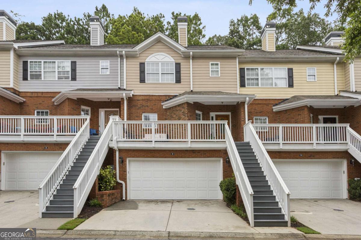 **6 MONTHS OF HOA FEES PAID BY SELLER WITH CONTRACT BY 9/15/25!!!!!** Welcome HOME to the most move-in ready, beautifully updated townhome in DREAM location in the heart of Alpharetta - minutes from favorite restaurants, shops, Roswell, Johns Creek, 400, and more!!! Prepare to be wowed from the moment you enter this light, bright, and airy townhome - with a rocking-chair front porch to greet you, outdoor relaxing & entertaining space abounds with ample room on front AND back decks! So much NEW...... FRESH interior paint throughout entire home, NEW LVP on main floor, NEWLY painted kitchen cabinets with NEW, on-trend hardware, ALL NEW kitchen appliances, TWO NEW HVACS... one just installed AUGUST 2025, and another one year old, custom accent walls, NEWLY RESEALED front patio with fresh epoxy, and so much more... nearly everything has been done for you, move right in and enjoy! Main floor features abundant natural light and bright, open floorplan that flows from eat-in kitchen to spacious yet cozy living room with plenty of room for office area or bonus sitting area, plus a fireplace!!! Private, quiet deck off living room is the perfect place to entertain or enjoy morning coffee. Upstairs features two spacious bedrooms, including oversized primary bedroom with HUGE WALK-IN CLOSET and generously-sized, luxurious primary bathroom with double vanity and separate tub/shower... lower level offers HUGE BONUS SPACE with endless opportunities.... The perfect home theatre, office, extra living/entertaining room, gym, or even a guest bedroom!!! TWO-CAR GARAGE!!!! Tucked away in a private, quiet enclave of home and minutes to all that Alpharetta and its surrounding communities have to offer!!! Don't miss your chance to call this house HOME!
