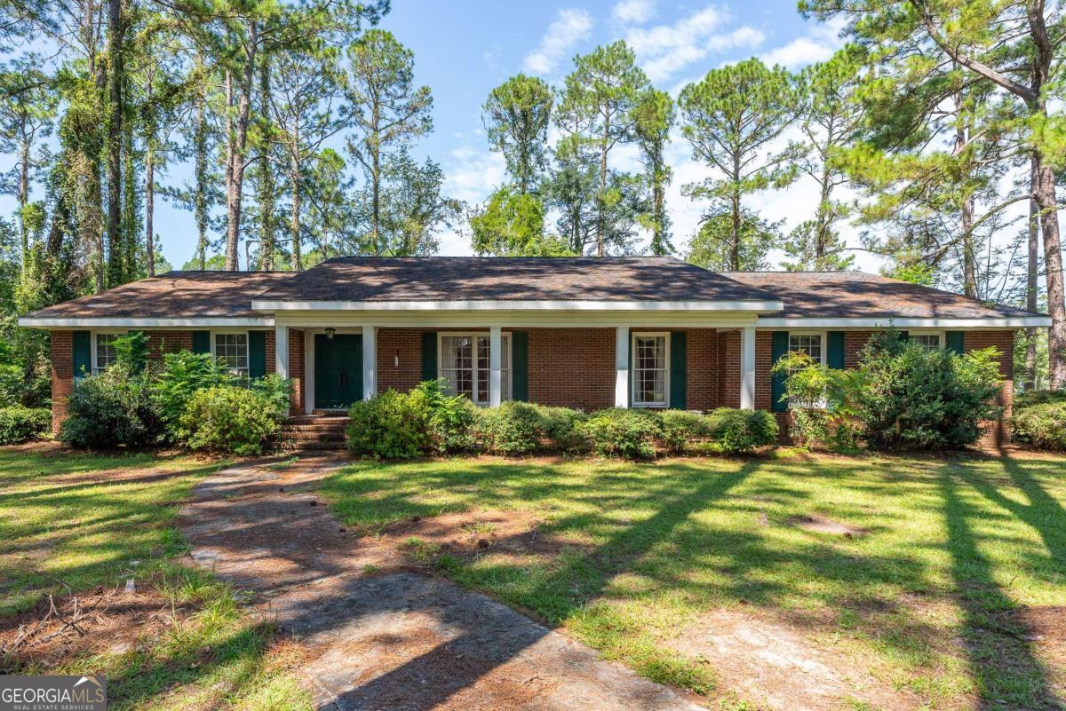 Charming County Home on Expansive Corner Lot - Nearly 3,000 Sq Ft! Welcome to this stunning and spacious home nestled in the peaceful countryside, perfectly situated on a large corner lot. Bursting with character and timeless charm, this nearly 3,000 sq ft residence offers room to grow, entertain, and truly make your own. Step through the elegant double front doors into a grand foyer that sets the tone for the rest of the home. Inside, you'll find a bright and airy sunroom, a formal dining room ideal for holiday gatherings, and a generous living room perfect for relaxing or hosting guests. The oversized laundry room adds convenience and storage galore. Every room is filled with warmth and unique details that make this home one-of-a-kind. With a roof less than 10 years old, the major updates have already been taken care of-just bring your personal touch and vision. Don't miss the opportunity to own this rare gem with space, style, and serenity, all just minutes from town conveniences.