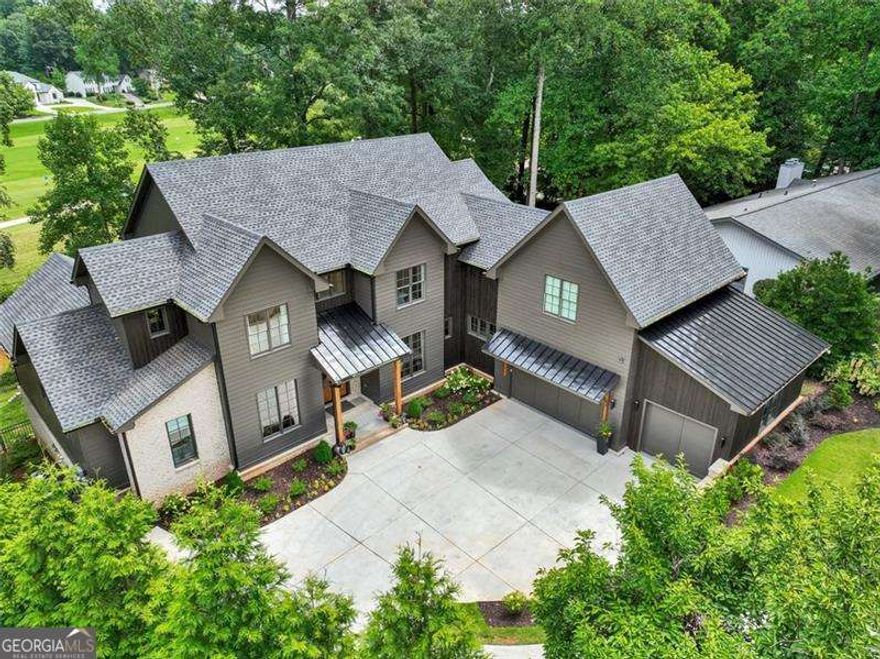 This stunning custom home, nestled on a prime golf course lot in the highly sought-after Indian Hills community, offers a one-of-a-kind floor plan and unparalleled privacy. Surrounded by the natural beauty of Sope Creek's waterway, the home is located on a peaceful cul-de-sac, ensuring tranquility and seclusion. Inside, you'll find an array of high-end finishes throughout.  As you enter through the two-story foyer, you're welcomed by a formal dining room and a cozy family room with full sliders that open to a spacious, oversized porch. Enjoy breathtaking views of the golf course and a charming fireplace perfect for evening relaxation.  This home features two luxurious owner's suites, one on the main and another on the terrace level. The gourmet kitchen is a chef's dream, boasting an oversized island, casual dining area, wet bar, and butler's pantry. Additional highlights include a mudroom off the garage, a private home office, and a bonus room above the garage.  Upstairs, you'll find four generously sized guest suites, each with its own en suite bathroom, along with a second laundry room and a large family room accessed through double doors.  The terrace level offers an impressive 2,200 sq. ft. of finished space, perfect for entertaining. This level includes a family room, game room, office, a second master/in-law suite, a wet bar, a wine wall, a beverage center, and an ice maker. Movie nights will never be the same with your private family theater complete with luxury seating for eight.  Step outside to the walkout terrace level, where a large covered patio and beautifully landscaped fenced yard await. Easy access to I-75, Historic Marietta, East Cobb Avenue, and more, this home promises an elevated lifestyle you won't want to miss.   Located in the highly sought-after East Cobb area, this stunning home offers top-tier education opportunities in the Wheeler Magnet School district, one of Georgia's premier STEM programs. Enjoy luxury living with golf course views, expansive living spaces, and access to top-rated schools.