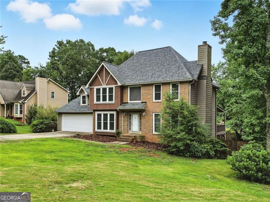 Homeowners Financial lender Jim Smith NMLS #545225 offering up to $1500 toward closing costs!* Welcome to this beautifully updated home in Marietta! The seller has invested over $60,000 in thoughtful renovations, including new flooring, fresh interior paint, and brand-new windows and blinds on the front of the home.  The kitchen has been completely transformed with sleek new cabinetry, updated appliances, and contemporary finishes-ideal for both daily living and entertaining. All bathrooms, including the spacious primary suite, have been stylishly renovated with custom tile work and updated fixtures, offering a spa-like experience.  The full basement features a separate split-unit A/C system and a finished room for additional recreational space. New stairs off the rear garage entry improve access to the newly fenced backyard, which offers plenty of room for relaxing, playing, entertaining, or letting pets roam. Roof was replaced in 2023!  Located in a highly rated school district, this home is just minutes from The Avenues of West Cobb, historic Marietta Square, and outdoor attractions like Kennesaw Mountain National Battlefield Park. With no HOA, this home combines flexibility, style, and location-all in one!