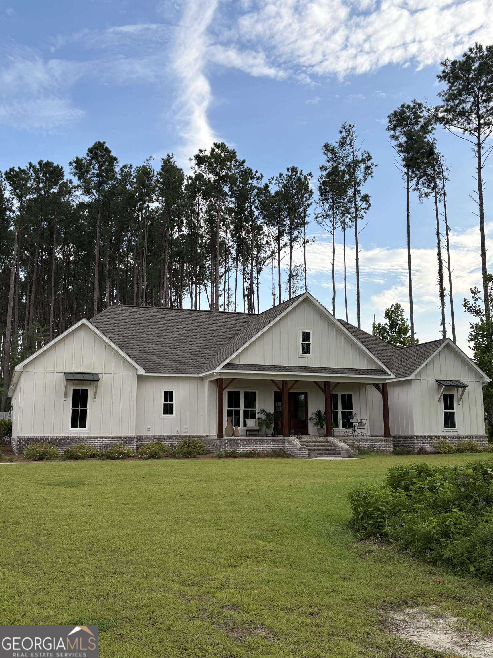 Custom built in 2023. ~ 2,700 sq/ft on 2.55 acres. Wooded lot peaceful & safe location. 4 spacious bedrooms big closets. 3 1/2 baths w/quartz countertops. Master bedroom has vaulted ceiling and master bath w/two separate vanities, soaking tub, separate water closet, custom tile shower w/wall & overhead shower heads. Large his/hers closet. Brick archway connects kitchen & family room. Kitchen has custom cabinets/large island, all w/quartz countertops. Large pantry, stainless steel appliances, & tray ceiling in dining area. Family room has vaulted ceiling & propane fireplace. Home also has office, linen closet, storage closet, large laundry room w/lots of cabinets. 2 car garage w/closet & pulldown ladder to attic storage. Wide baseboards & laminate floors throughout. Huge covered back porch w/stained wood ceiling. Front porch has solid wood columns & stained wood ceiling. Partially fenced backyard, private wooded land behind house. Sprinkler system in front yard. Septic tank, city water