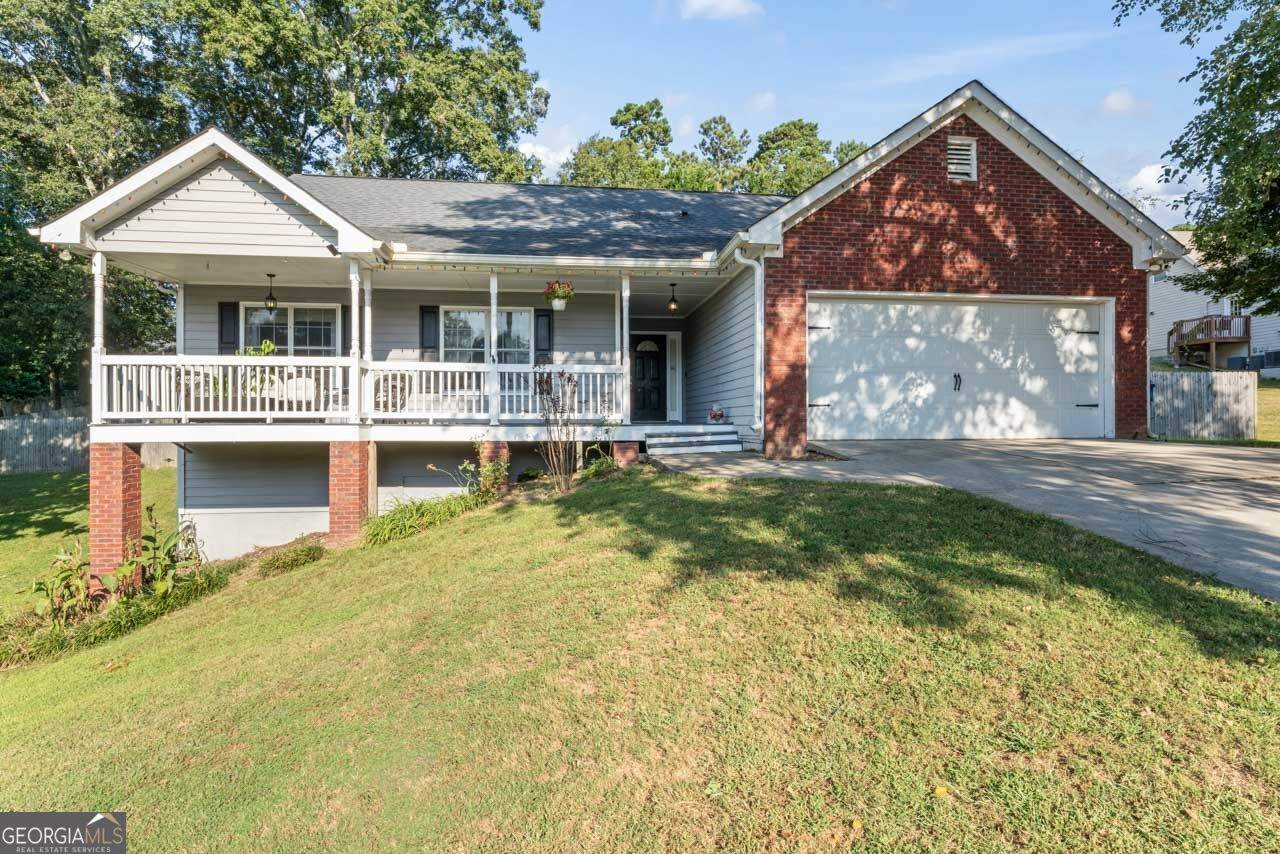 Welcome to this spacious 4-bedroom, 3.5-bath home located in a well-established Loganville community. Set on a generous lot, the property combines comfortable living spaces with a functional design and flexible options for today's lifestyle. The main level features three bedrooms and two full bathrooms, including a well-appointed primary suite. A convenient laundry room and access to the two-car garage with a garage door opener add everyday ease. The living and dining areas flow naturally, and a rear deck extends the living space outdoors, providing a great spot for relaxing or entertaining with views of the backyard. The finished basement adds even more versatility, offering an additional bedroom, bathroom, and bonus areas ideal for a media room, office, playroom, or guest suite. This expanded living area provides multiple options to fit your needs. Located in a clean, quiet community with sidewalks and well-maintained homes, this property offers a welcoming neighborhood environment. Families will appreciate the close proximity to schools, while shopping, dining, and major roadways are just minutes away for convenience. With 4 bedrooms, 3.5 bathrooms, a finished basement, and a desirable Loganville location, this home presents a wonderful opportunity for buyers seeking space and value in a sought-after community.