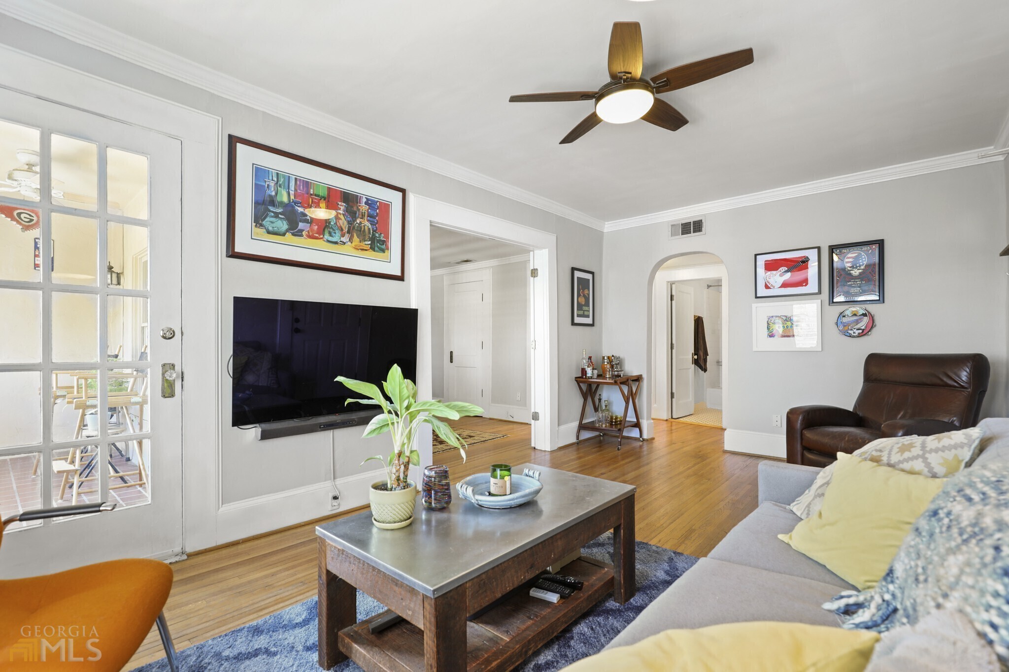 Piedmont Park in Your Backyard! With a Prime Intown Location, this Spacious, Top-Floor Condo offers unmatched urban convenience. Curved Archways and Hardwood Floors welcome you into a Living Room with Private, Step-Out Balcony ideal for entertaining. French Doors invite you into the first of Two Large Bedrooms. The Flexible Floorplan continues into a Bright, White Kitchen with Ample Storage Space, Walk-in Pantry, and Breakfast Nook. A Dedicated Laundry Room and Additional Basement Storage complete this captivating condo. Pre-Wired for Google Fiber Internet. NEW Roof and HVAC! STEPS to Piedmont Park, The BeltLine, Midtown Shopping, and World-Class Dining.