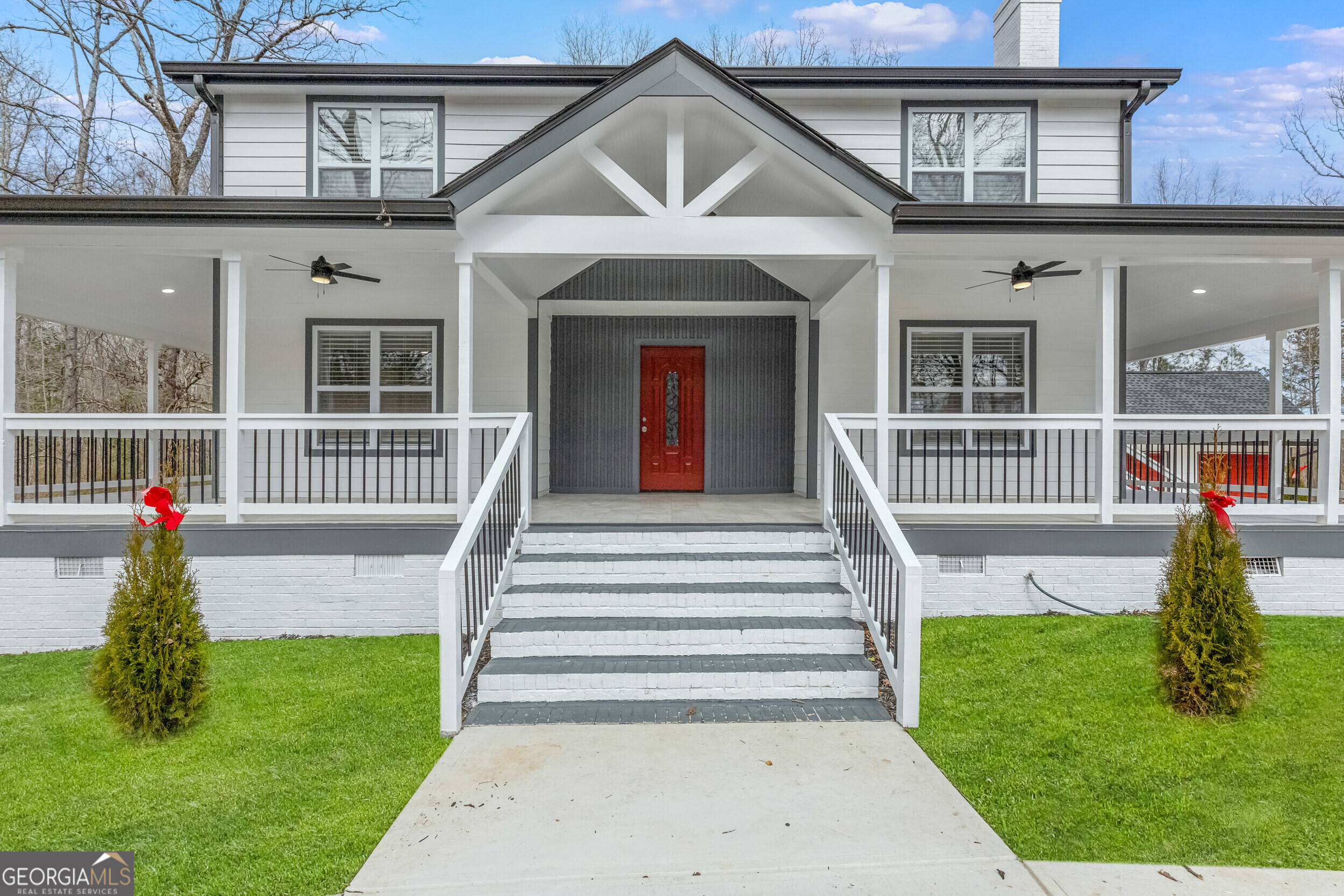 Welcome to this meticulously crafted, custom renovated craftsman home, where nothing has been overlooked. With five bedrooms and three full bathrooms, this home is designed with strict attention to detail and an inviting sense of warmth. As you approach, you'll be greeted by a charming three-sided wraparound porch, perfect for enjoying morning coffee or evening relaxation. Step inside to discover an open floor plan that flows effortlessly. The spacious living room, featuring a cozy fireplace, sets the stage for comfortable living. The kitchen is a chef's dream, boasting all-new stainless-steel appliances, elegant granite countertops, and pristine white cabinets. The breakfast bar and bright breakfast area offer additional spaces for casual dining. Throughout the home, you'll find all-new flooring, enhancing the fresh and modern ambiance. On the main level, you'll find a formal dining room for special gatherings, a versatile bedroom that can double as an office, a convenient walk-in pantry, and a well-appointed laundry room. The second-floor houses four generously sized bedrooms, including the primary suite, which features a relaxing sitting area. Each bedroom offers ample space and spacious closets, ensuring comfort for everyone. The home showcases three spectacular full bathrooms, with the primary bathroom being particularly impressive-don't miss it! This home has been thoughtfully upgraded with all-new electrical, plumbing, lighting, and a rebuilt fireplace. Fresh paint inside and out adds to its appeal. The exterior features include a wraparound porch with exterior ceiling fans, new cement siding, a new roof, a circular driveway, a gravel driveway, and a back deck. The property also includes a two-car detached garage with a workshop/storage area, all set on a little over an acre of gated property for your privacy. Conveniently located about 30 minutes from Hartsfield-Jackson Airport and with easy access to I-85, this home truly has it all.