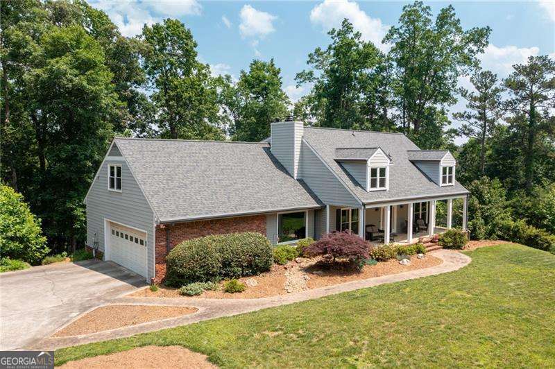 Tucked away on 2.2 private acres in the top-rated Garrison Mill, Mabry, and Lassiter school district, this home offers the perfect blend of privacy and opportunity. With no HOA and one of the largest lots in the area, the possibilities are endless-expand the home, add a pool, create a detached garage, subdivide the lot for family or investment, or simply enjoy the freedom of space. Inside, you'll find over 4,000 sq ft with fresh paint, updated systems, and space to design the lifestyle you want. Do you imagine a home full of charm and character, with room for an office, a library, or a separate entertainment area to host friends and family? This is it. The kitchen sits at the heart of the home, filled with natural light and views of the serene trees, creating a warm space to gather and share meals. Upstairs, there are four spacious bedrooms, with a half bath on the main level and a basement already stubbed for a bathroom-giving you room to expand even further. With so much storage and flexible space, the home can grow with your vision. Step outside to your private retreat-enjoy coffee on the expansive deck, relax in the outdoor hot tub, or gather around the firepit as you take in the peace of your wooded surroundings. Now offered at a price that gives you the opportunity to create instant equity in a thriving area, this is your chance to make a truly special property your own.