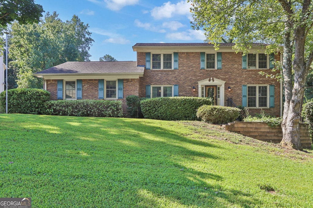 Fabulous home in the award-winning Brookwood school district. Well maintained home in a quiet established neighborhood. Pella windows make this home super energy efficient! Main level hosts gleaming hardwood floors in the living areas, galley kitchen with solid surface counter tops, stainless steel appliances including a double oven, plus a bedroom and full bath. Upstairs you will find a spacious owner's en suite with his and hers vanities, soaking tub, separate shower. Two other generous sized bedrooms and another full bath round out the upper level. The terrace level hosts a flex area plus plenty of additional storage. Find your personal paradise in the backyard. Relax in your outdoor living area featuring composite decking and aluminum balusters to avoid maintenance, a gunite swimming pool with a loop lock cover and still plenty of room to romp and play. Concrete pad to store recreational vehicles - just one of the many benefits of living in a community without a HOA