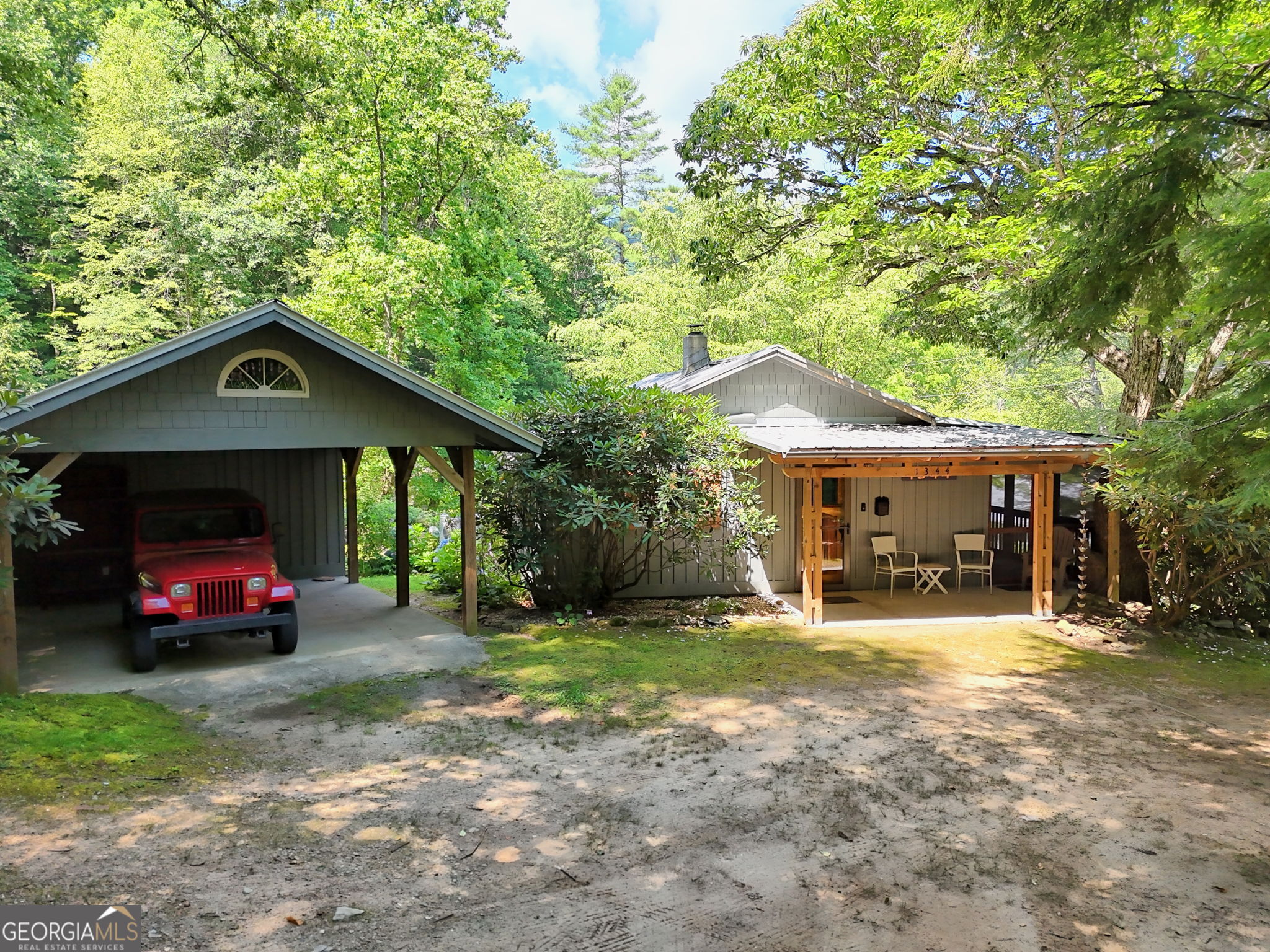 Welcome to a beautifully renovated 2-bedroom, 2-bathroom home nestled in the heart of serene Tate City, Georgia. Originally built in the 1960s, this home has been thoughtfully updated to combine rustic charm with modern comforts. Tucked away in a peaceful and private setting, this cozy retreat is perfect for full-time living, a weekend getaway, or a vacation rental investment. A peaceful stream winds through the center of the property, feeding two serene ponds and creating a tranquil backdrop.Flat lot to enjoy quiet mornings or family gatherings at the gazebo, nestled beside the water and surrounded by nature.The home features updated interiors with warm wood finishes, inviting living spaces, and plenty of natural light. The kitchen and bathrooms have been tastefully modernized, and a new septic system and pump were installed in 2016 for worry-free living. Surrounded by the beauty of the North Georgia mountains, this property offers a unique blend of privacy and natural beauty-ideal for nature lovers, hikers, and those seeking a slower pace of life. Don't miss your chance to own a piece of mountain paradise in one of Georgia's best-kept secrets.