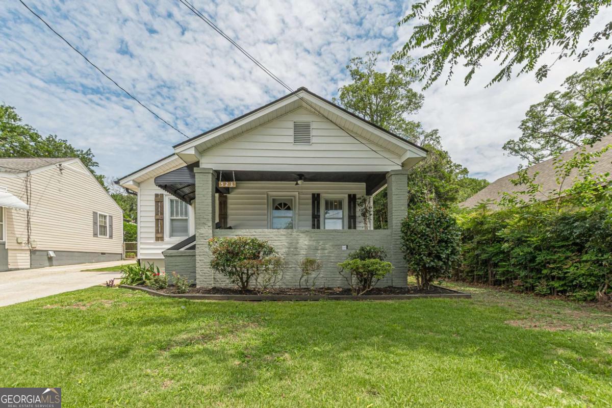 Charming 1920 Bungalow in the Heart of Hapeville. Vintage Character Meets Modern Comfort. This beautifully maintained 2-bedroom, 1-bath 1920 bungalow blends classic charm with thoughtful updates. Freshly painted inside and out, it features vintage touches like shadow molding, a separate dining room, and a welcoming rocking chair front porch-plus modern fixtures and stylish finishes throughout. Step into a spacious living room filled with natural light, and enjoy the private patio that overlooks a tranquil garden-perfect for relaxing or entertaining. Unbeatable Location: Walk to downtown Hapeville's vibrant restaurants, coffee shops, and parks. Convenient to downtown Atlanta, Hartsfield Jackson International Airport, Porsche HQ, Delta Airlines HQ, and Woodward Academy. This is your opportunity to own a piece of history with modern ease, all in one of Hapeville's most walkable and sought after neighborhoods.