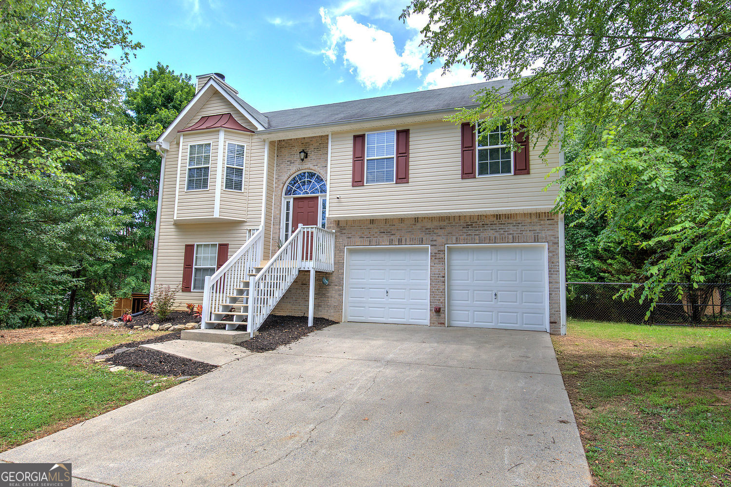 Welcome Home to this beautifully updated 4-bedroom, 3-bath home situated on a spacious 0.68-acre lot with no HOA. From the moment you arrive, you'll notice the fresh exterior with new landscaping, freshly painted front door, shutters, and porch that invite you in with exhilarating warmth and charm. Step inside to the new luxury vinyl plank flooring throughout the main level. The split staircase has been enhanced with custom pine steps and white risers, while freshly painted walls and ceilings throughout both levels create a bright, welcoming atmosphere. Cozy up in beautiful Family Room that features wood burning fireplace and eye-catching built-ins. The kitchen boasts of granite countertops, white cabinets and stainless appliances, featuring brand new smart stainless steel range, complete with convection cooking and built-in AirFryer for everyday convenience. Inviting Owners Bedroom complete with bath, 2 spare bedrooms on main level and spare bath, refreshed downstairs bedroom or if you prefer recreational room complete with bath showcasing updated lighting. Enjoy the added touches of new custom faux wood blinds, updated door hardware. Additional highlights include a new 5' black chain link fence with gated access, professionally cleaned air ducts, new floor vent registers, and a newly serviced septic system. The home has been professionally cleaned and is move-in ready. Best part...included 1 year 7-Star Home Warranty for added peace of mind. This home offers the perfect blend of comfort, style, and tranquility ready to Welcome You Home!