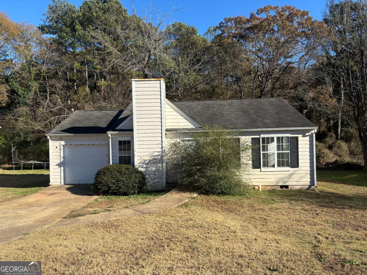 Welcome to 4262 Catalpa Park, a charming 3-bedroom, 2-bathroom ranch located in the Linecrest neighborhood of Ellenwood, Georgia. Built in 1990, this cozy home offers 1,024 square feet of living space on a level 0.23-acre lot. The property features an open living area with a fireplace, an eat-in kitchen, and a primary suite with a tub/shower combo. The one-car garage adds convenience, while the back deck provides a great space for outdoor relaxation. This home is perfect for first-time buyers, downsizers, or investors looking for a great rental opportunity. Located near Cedar Grove schools, parks, and shopping, it offers a balance of tranquility and accessibility. Schedule your showing today and make this home your own!