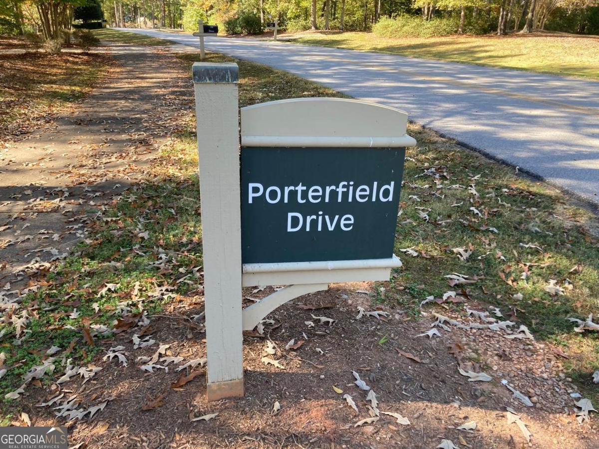 Fabulous interior lot within walking distance to the Clubhouse and Lake. Very nice .7 acre rectangular building lot with an additional 40 yards buffer on one side and in the rear. Lots of privacy and filled with hardwood trees. Perfect for a one story but a walkout basement home is also an option. No membership opportunity is available on this property, thus the excellent price. Location, privacy and value, don't miss it.
