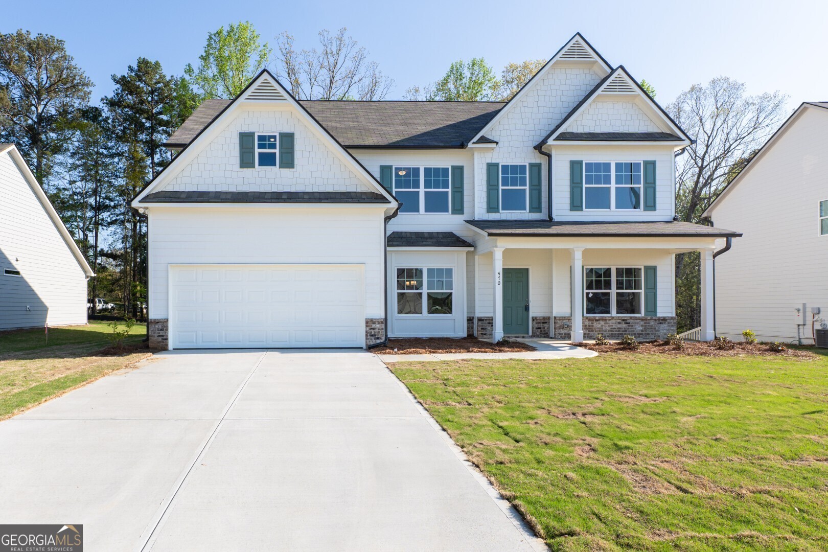 Stunning Woodbridge Plan - Grand Design with Main-Level Guest Suite. This beautifully crafted Woodbridge Plan is now available at an incredible price! From the moment you step onto the welcoming front porch, you'll know you've found something special. Inside, the thoughtfully designed layout includes a main-level guest suite with full bath-ideal for visitors or multi-generational living. A dramatic two-story foyer flows into the formal living and dining rooms, setting the stage for elegant gatherings. At the heart of the home, the gourmet kitchen dazzles with Dallas White granite countertops, a central island, deep single-basin sink, and elegant white cabinetry. The kitchen opens seamlessly into a breathtaking family room with soaring 18-ft ceilings-an entertainer's dream! Upstairs, the sleek catwalk overlooks both the foyer and family room, adding architectural flair. The oversized master suite features a cozy sitting area and a spa-inspired bath with marble countertops, dual vanities, separate tub and shower, and a spacious walk-in closet. Additional highlights include an upstairs laundry, full hall bath with raised vanity and linen closet, and designer touches throughout.