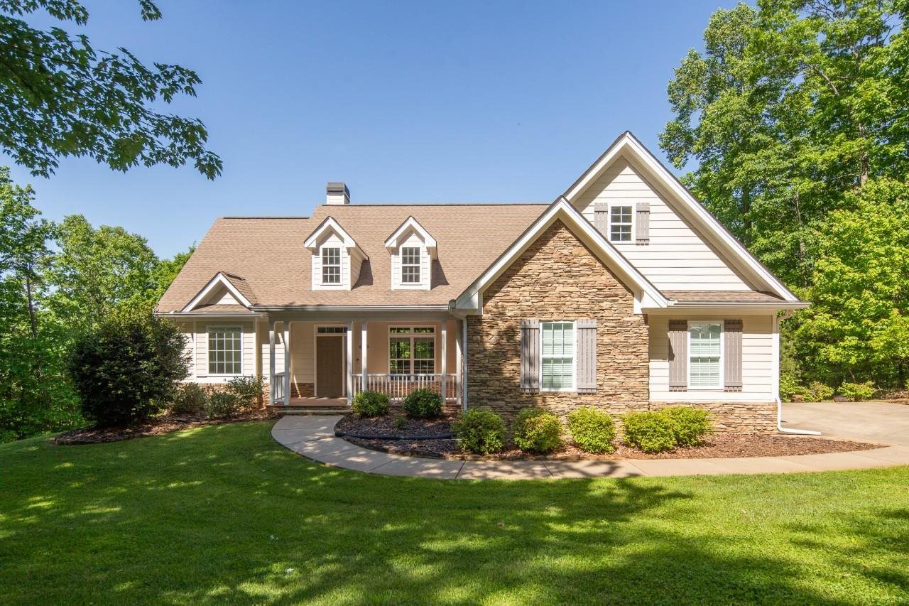 RANCH STYLE home on 5 wooded acres. Off the beaten path,peaceful mountain setting, 2000 feet above sea level, across the entrance from Amicalola Falls State Park. TWO SEPARATE GRAVEL ROADS, GIVES PRIVATE ACCESS TO THIS DELIGHFUL HOME. Custom built, one owner home features stacked-stone and clapboard-look exterior design with architectural shingles. A Donald A. Gardner house plan with an open concept floor plan, a walk-out, full-daylight basement ready to be finished (3rd bath already roughed in).Oversized 2 1/2 car garage with storage. Unfinished bonus room. If you love a private setting this is IT.