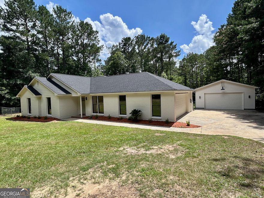 Completely remodeled 3BR/2BA home on 1.05 acres, offering the perfect blend of privacy, space, and modern upgrades. This move-in ready gem features a brand-new architectural roof on both the home and detached garage, new HVAC, new flooring, updated light fixtures, fresh interior/exterior paint, and gorgeous landscaping. Enjoy the huge fenced backyard, new deck, and serene setting.    The stunning kitchen boasts custom-painted cabinets, quartz countertops, tile backsplash, and new stainless steel appliances. Spacious two-car attached garage plus a fully wired detached garage/workshop. Located in a top-rated school district and convenient to everything. Like new - a must see!