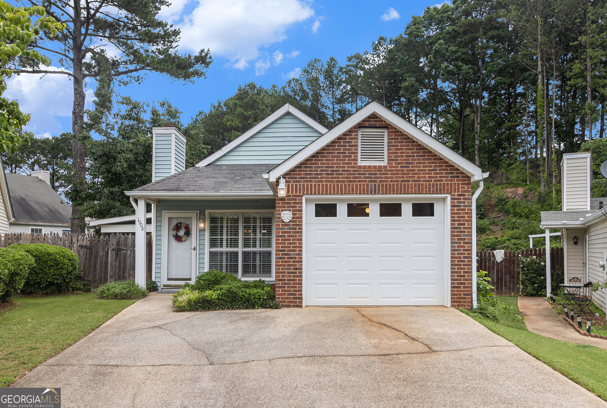 Welcome home to one-level living! This beautifully maintained 2-bedroom, 2-bath ranch home with a 1-car garage awaits you in the desirable Villages at Cobblestone. Located in an ideal setting minutes from downtown Woodstock with super easy access to Hwy 92 and I-575. Move right in and enjoy the perfect blend of comfort and convenience, featuring gorgeous granite in the kitchen and bright, elegant wood plantation shutters throughout. The must-see, custom-built screened porch is a true standout in the neighborhood and is sure to become your favorite spot to entertain or unwind while enjoying peaceful views of the lush, private backyard. Coveted 1-car garage features automatic opener, laundry area, and plenty of storage space. Includes refrigerator, washer, and dryer, as well as 1-year home warranty for extra peace of mind. Neighborhood amenities include a sparkling pool and spacious playground-perfect for sunny days and entertaining guests. The low-cost HOA maintains common areas, the pool, and the front and side yard-all for only $452/year. Don't miss your chance to make this charming home yours-easily schedule a showing today.