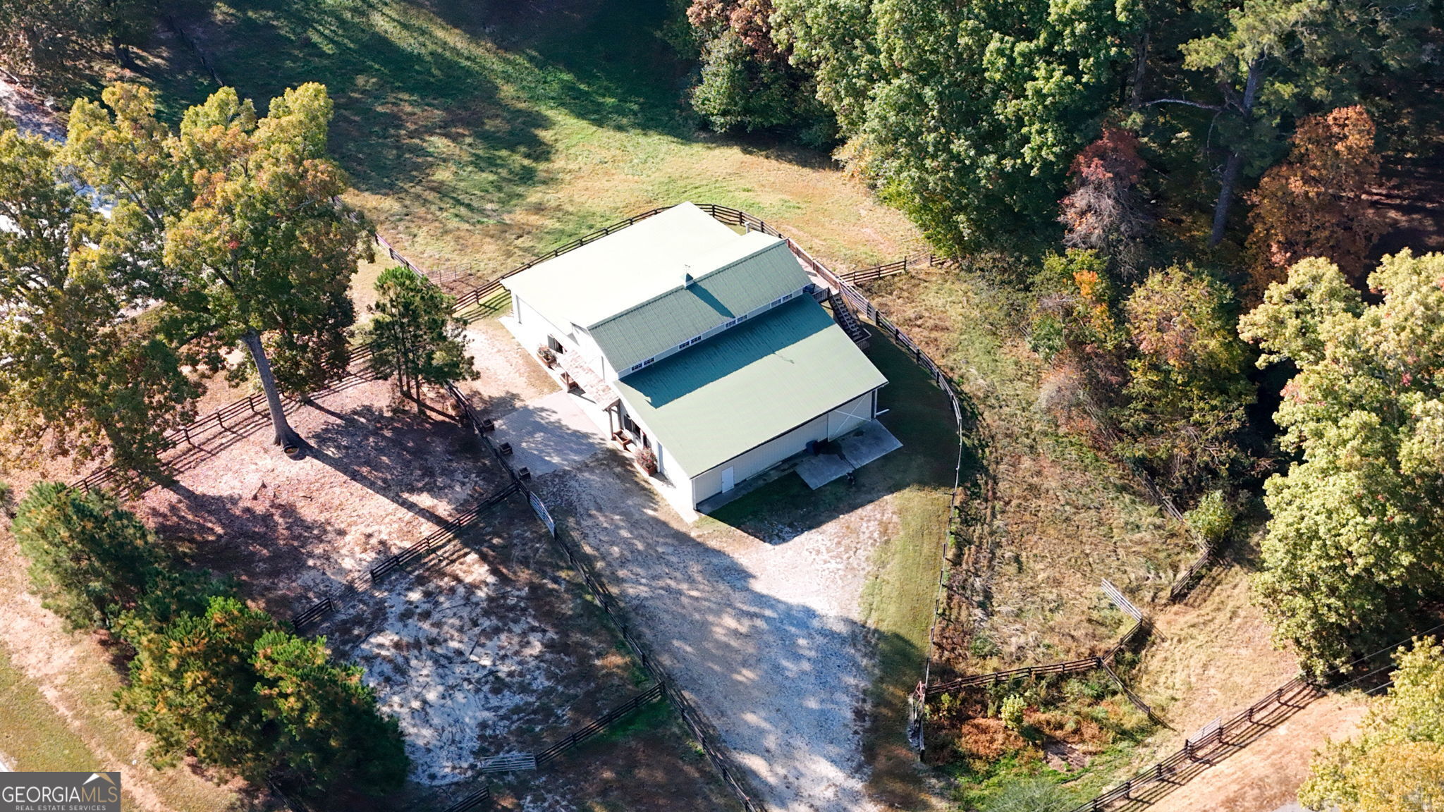 Discover this picture-perfect opportunity to own land in Alpharetta, one of the most desirable areas to live in North Atlanta. Bring your builder! Make your house-dream a reality and build an exquisite, high-end home you'll love; exactly as you've envisioned it! With just over 3 acres, this lot provides substantial space for your custom build home. Let your imagination run free...design an exquisite backyard, add a pool and enjoy this idyllic country-style lifestyle just minutes away from major highways, trendy restaurants, and shops in Avalon, Crabapple Crossroads, and Halycon. The location of this property is fantastic, the Alpharetta-Milton area is known for its excellent schools, equestrian lifestyle, and vibrant community. This stunning property offers a large six-stall barn with spacious 14 x 14 stalls, a designated kitchen-style feed room, a tack room, wash bay area, shaving room storage, hay room storage, and room for farm equipment. There is more...the barn has a one-bedroom apartment above, equipped with a kitchenette and a full bathroom. This barn can also be transformed into a Barndominium, the possibilities are endless! If you would like to explore your equestrian pursuit, this property is ideal for you! The property offers ample road frontage for easy access and visibility. Imagine the possibilities as you design a beautiful home and bring your vision to reality, surrounded by the serene beauty of nature and the charm of rural living. Whether you are looking to create a luxurious estate or a mini horse farm, you can enjoy the tranquility of country life. Don't miss out on this unique opportunity to invest in a lifestyle that combines the best of both worlds - country living with modern conveniences. Make your dream a reality today! Assemblage possible.