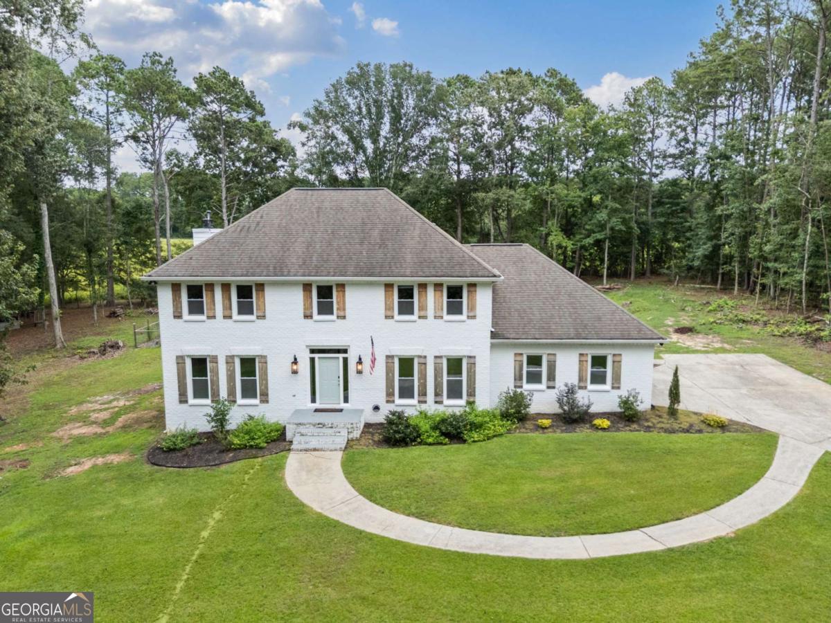 Stunning All-Brick Executive Home on 2.5 Private Acres 4 Bed 2.5 Bath + Home Office This beautifully reimagined executive home blends timeless charm with modern luxury, all set on a serene 2.5-acre lot offering complete privacy in the backyard. Featuring 4 spacious bedrooms, 2.5 designer bathrooms, and a dedicated home office, every detail has been thoughtfully curated with premium finishes throughout. Enjoy a chef-inspired kitchen with quartz countertops, all-new shaker cabinets, a custom built-in hood vent, and a large island with shiplap and Brazilian Garapa wood is perfect for entertaining. Real hardwood floors run throughout, complemented by shiplap accents, barn doors, and designer lighting. All bathrooms include elegant marble vanities and luxurious Japanese Toto bidet toilets with heat, while the primary suite features a reclaimed wood & shiplap ceiling, massive custom closet and custom built double barn doors leading to the vaulted ceiling bath with oversized frameless glass shower and soaking tub. Prime Location Just 3 minutes from Trilith Studios, world-class dining, boutique shopping, and the brand-new professional soccer training facility. Enjoy convenience without sacrificing tranquility. This one checks every box - schedule your private tour today! Rental Requirements: Background check, employment/income verification (3x rent), and credit check. No recent evictions or serious criminal history. $55 Application fee per adult. Pets considered with approval and additional deposit + pet rent. 1.5x monthly rental security deposit, and first months rent due at signing.