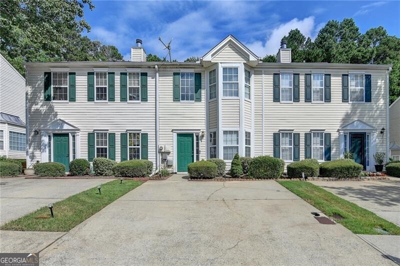 This 2-bedroom, 2.5-bath townhome is just minutes from vibrant Downtown Lawrenceville, offering convenience and potential! The popular roommate floor plan features two spacious upstairs bedrooms, each with its own private bath. The open-concept main level includes a large living area and kitchen that flow nicely to the generous backyard-partially fenced and perfect for relaxing or entertaining. This home is priced accordingly due to multiple cosmetic issues, both inside and out. Please note: there is an active water leak in the front closet coming from the exterior, and the home will need updates and repairs. Great investment or renovation opportunity for someone willing to bring it back to life. Sold as-is. Don't miss your chance to own a property in a prime location at an unbeatable price!