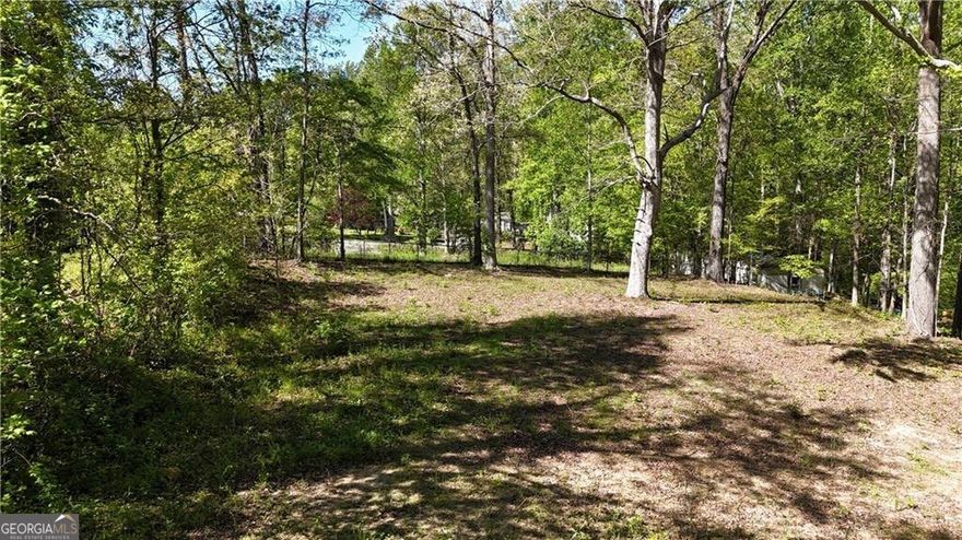 Rare find of 1.5 acres ready for your next investment project!   2000 gallon septic tank already installed on property.