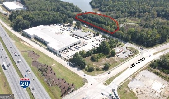 Just south of I-20 and Lee Road Interchange. Lee Road is in the process of being four laned from I-20 to Hwy 92. 2.44 acres (1.32 outside of floodplain and gas easement). Zoned Light Industrial in Douglas County. Adjacent to Sweetwater State Park with view of the Reservoir at the Park. Over 500 feet of road frontage on Monier Ave.