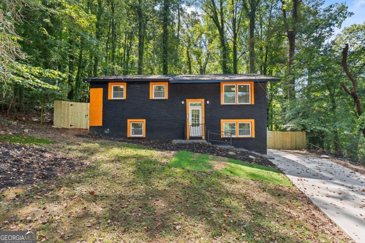 Beautifully Renovated 4BR/2BA Home in East Point Nestled on a quiet cul-de-sac in East Point, this stunning two-level home features a modern renovation with thoughtful upgrades throughout. The open-concept main level boasts sleek white cabinetry, bold black hardware finishes, and stainless steel appliances-perfectly blending style and functionality. With 4 spacious bedrooms and 2 full bathrooms, this home offers versatile living options. The fully finished lower level serves as an ideal guest or in-law suite, complete with a private entrance, a large living area (perfect for a family or game room), and a dedicated laundry room. Enjoy the serene, private backyard-ideal for grilling, entertaining, or relaxing in peace. Conveniently located just minutes from I-285, Hartsfield-Jackson International Airport, the Porsche Experience Center, and Tyler Perry Studios, this home offers both tranquility and accessibility. Don't miss your chance to own this move-in ready gem in one of Atlanta's most desirable up-and-coming areas!