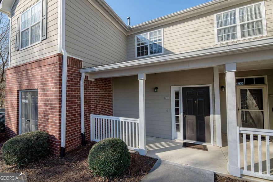 Updated End Unit Townhome in Gated Community. 2 Bedrooms and 2 Baths. The Covered Front Porch welcomes you. Open Concept Floor Plan with Soft Neutral Colors, Updated Fixtures and All LVP / Tile Flooring. Modern Kitchen features Granite Counters, White Cabinets, Tile Backsplash & Peninsula Island. Separate Dining Area. Spacious Family Room with Great Natural Light and Gas Logs Fireplace. Split Bedroom Plan with Spacious Primary Suite including Walkout Access and Large Master Closet. Master Bath boasts Double Vanity with Granite Counters and Tub/Shower Combo. Secondary Bedroom has Adjacent Full Bath. Private Balcony for Quiet Evenings & Saturday Morning coffee. Woodlands at Webb Bridge is a Manicured, Walkable Community with a Beautiful Pool. Gated Community in a Great Alpharetta Location. Convenient to 400, Avalon, Shopping, Dining, etc. Sought after Alpharetta High School.