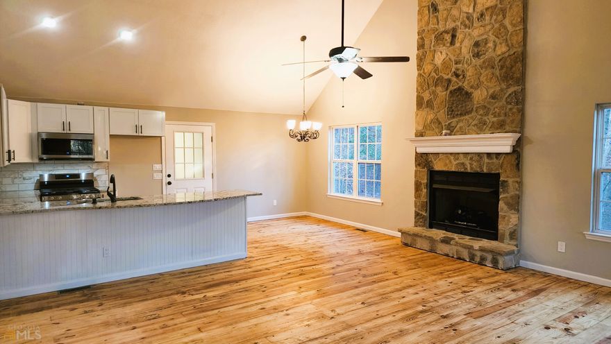 This beautiful 3 Bedroom 2.5 Bath cabin has modern feel and surrounded with nature in the heart of the valley and beautiful views of mountains, lakes, hiking trails, waterfalls, stream of waters nearby. Main level has a great room with a Master bedroom with attached bathroom. The fireplace has beautiful stack rock with gas fireplace to keep you cozy on cold winter nights. This cabin offers an updated kitchen with SS Appliances, Granite Countertop with a breakfast sitting area, a large kitchen sink, hardwood floors on the main level, and LVP on the bedroom and downstairs. High ceilings in kitchen/Living room/Dining area. The driveway is paved for easy access to the cabin! This cabin has a huge, covered deck for sitting and enjoying the peace and quiet of the beautiful nature around and enjoy the view of the mountains. This cabin is within the close proximity of famous spots like Lake Hiawassee, The Brasstown Valley Resort where you can enjoy nightlife and great restaurants for dining, Brasstown Bald, Chattahoochee Forest, Blue Ridge Mountains Range that offers beautiful views during all 4 seasons (View of Fiery Red Mountains in Fall), scenic drive with breathtaking views. Young Harris College, parks, lakes, and waterfalls are close by for great fishing experience and tubing for enjoyment.