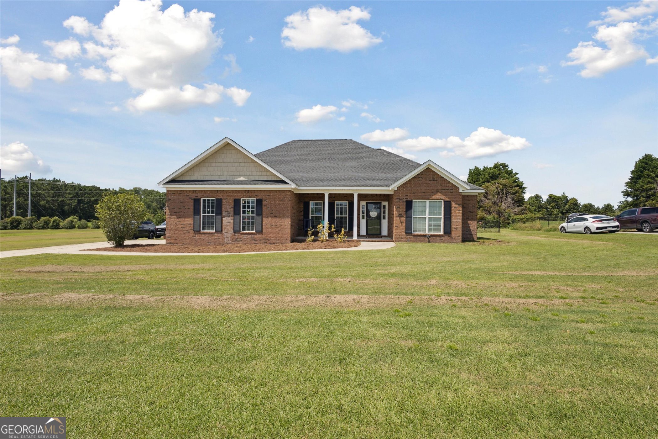 Beautiful all-brick 4 bedroom, 2 bath home on a .64-acre lot in Bulloch County. This home features an open floor plan with a split bedroom design and a custom shiplap accent wall in the living room. The kitchen offers ample cabinetry, pantry storage, and an island with seating. Enjoy the large fenced backyard with a covered deck-perfect for entertaining. Additional highlights include spray foam insulation, an HVAC system only a few years old, and an RV hookup located behind the fence. Move-in ready and well maintained, this home offers comfort, efficiency, and plenty of space inside and out.