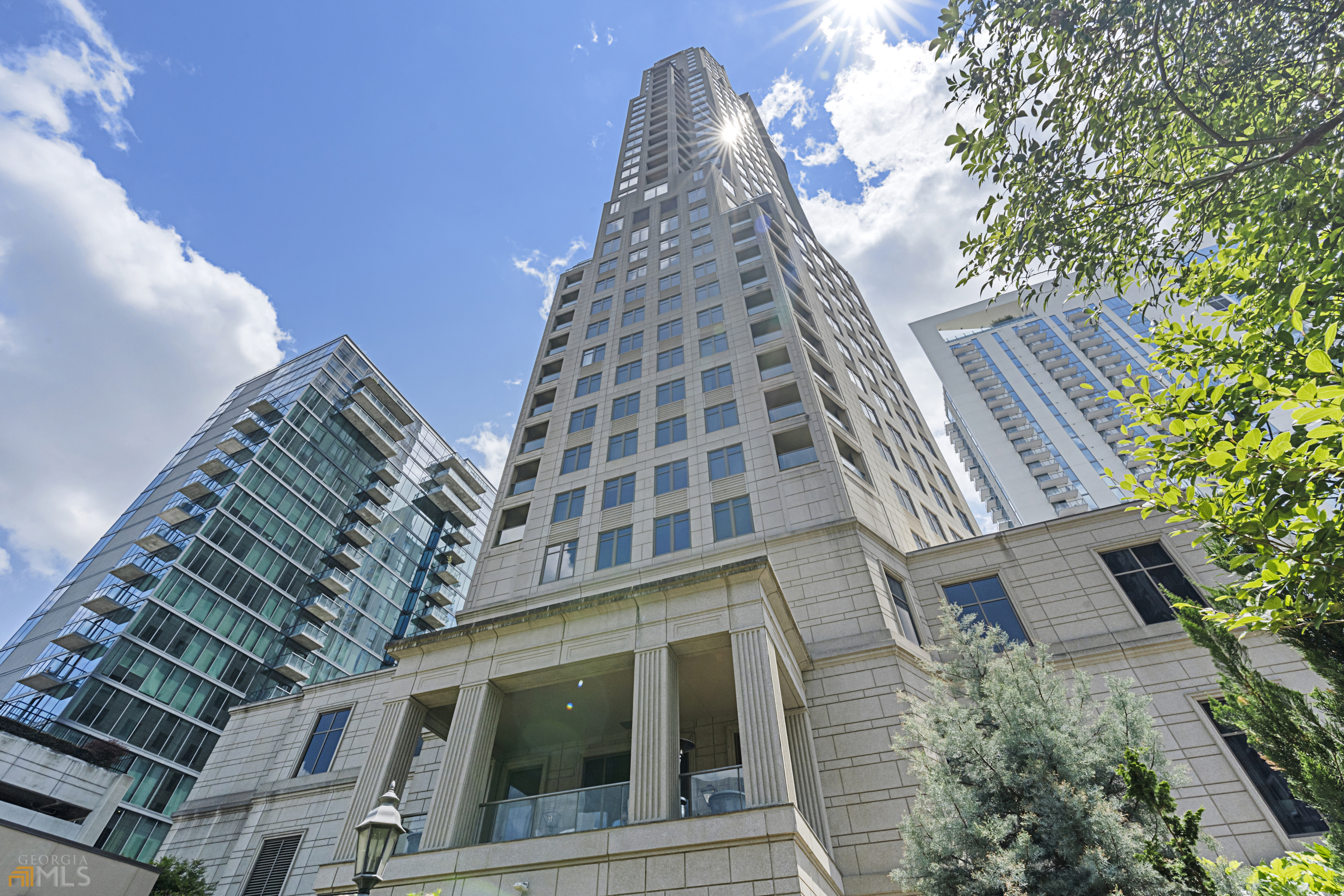 Exceptional, full floor home with 360-degree views located in one of AtlantaCOs premiere luxury high rises. Enjoy the convenience and ease of high rise living coupled with Waldorf AstoriaCOs world class amenities (including 24-hour concierge staff, security & hotel room service, fitness center & spa, private residence and more detailed below). Designed by Harrison Design and decorated by Jessica Bradley Interiors, this LIKE NEW home was designed to capture the stunning views from each room. Features include marble kitchen and baths; Victoria & Albert and Waterworks plumbing; Subzero, Wolf & Miele appliances; temperature-controlled wine wall; 11ft ceilings; catering kitchen; 2 laundry rooms, a Control4 home automation system; and an open floor plan ideal for entertaining and everyday living. Step off the elevator into the grand, marble foyer that leads to the large living room with gas fireplace, fully equipped wet bar & wall of windows to take in the views. Spacious dining room, anchored by a wine wall, opens to the comfortable kitchen with marble island & banquet breakfast area overlooking the city skyline. Relaxing primary suite features a separate sitting area with morning bar, beautiful bedroom with tray ceiling, and luxurious marble bath. 2 spacious guest rooms with en-suite baths are separate from the primary suite creating ample privacy. 4th bedroom is currently used as study and features a hidden walk-in closet and private bath. Enjoy sunrises and sunsets from the TWO COVERED BALCONIES both with incredible views (primary balcony off living room has gas fireplace and Viking grill - ideal for entertaining). Waldorf Astoria amenities include 24-hour concierge staff and security, valet parking, 24-hour hotel room service, five-star spa, indoor heated lap pool, fitness center, catering services, maintenance engineer & more. Private residence entrance & parking garage located off Stratford. Unit comes with a storage unit and two deeded parking spaces.