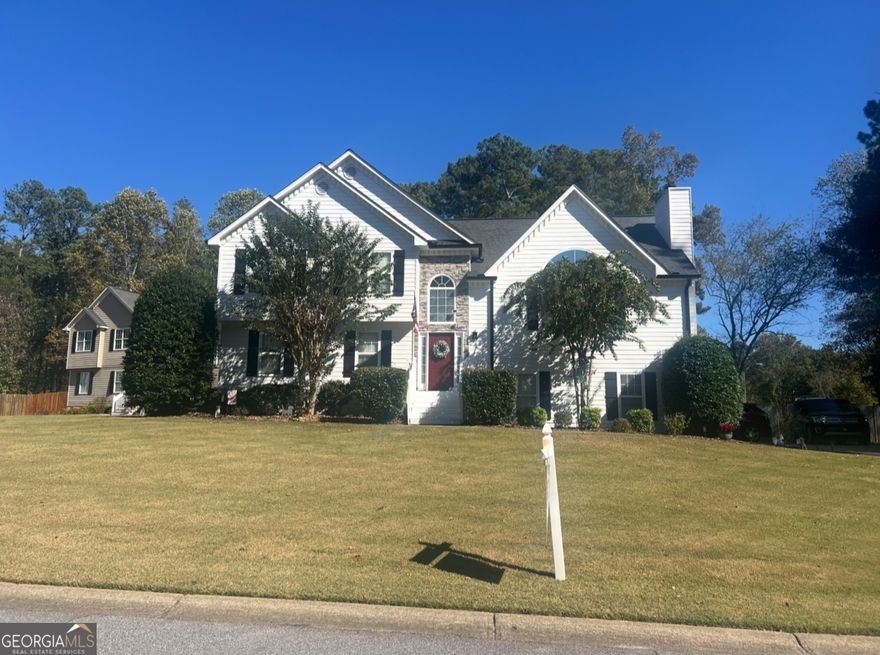 This is a beautifully maintained 5 bedroom, 3 bathroom home nestled in the desirable Cheatham Lakes community of Acworth. This charming residence offers the perfect blend of space, comfort, and convenience with an inviting floor plan and serene outdoor setting.  Step inside to find a bright, open main level with soaring ceilings, a spacious family room with a cozy fireplace, and abundant natural light. The updated kitchen features stainless steel appliances, ample cabinet space and a breakfast area overlooking the private backyard.  The owner's suite boasts a walk-in closet and an en-suite bath with double vanities, soaking tub and separate shower.  The finished main floor that is accessed through the garage provides flexible living options- ideal for a guest suite, home office or playroom complete with a full bath.  Outside, enjoy peaceful mornings or weekend gatherings on the newly expanded deck overlooking the backyard.  Located on a quiet street just minutes from downtown Acworth, Lake Allatoona, shopping and top rated schools, this home offers the best of suburban living with easy access to  I-75 and major commuter routes.