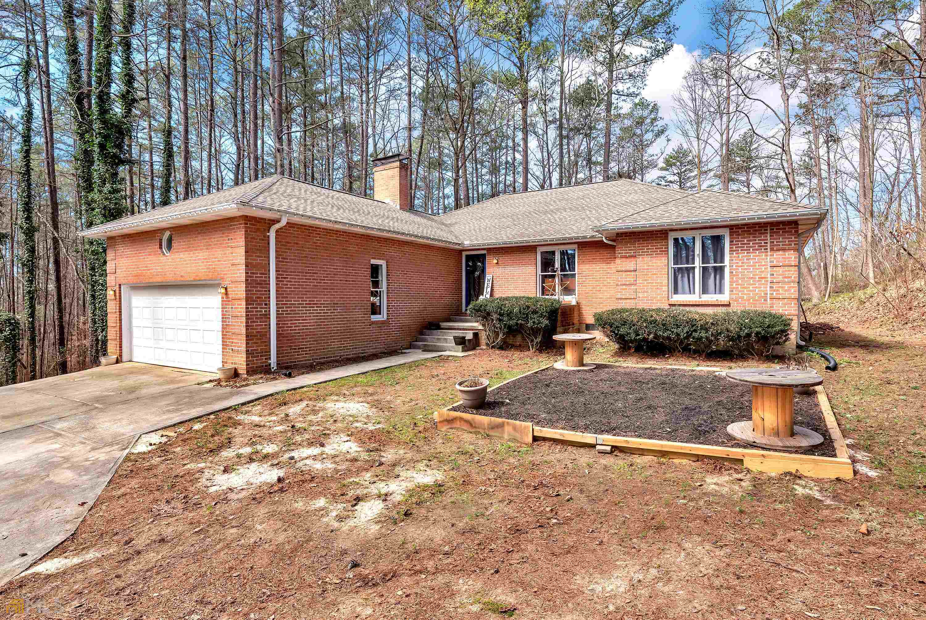 This is a must see custom brick home in a private , rural neighborhood. 4 bedrooms, 2 bathrooms, formal living room , dining room, den with a beautiful fireplace. Large deck off the formal living room/dining room. This area is great for entertaining and grilling out. The owner has maintained this home in a unbelievable manor. New Pergo Timber-craft plank flooring. Freshly painted , New stainless dishwasher and stove. Kitchen has new countertops. Laundry room with new vinyl flooring, 2 gar garage." New roof in 2018 Two HVAC Units ( 2011 and 2021) Water Heater ( 2017 ) Huge Attic. Property is in a highly desired neighborhood. Come make this wonderful property yours today.