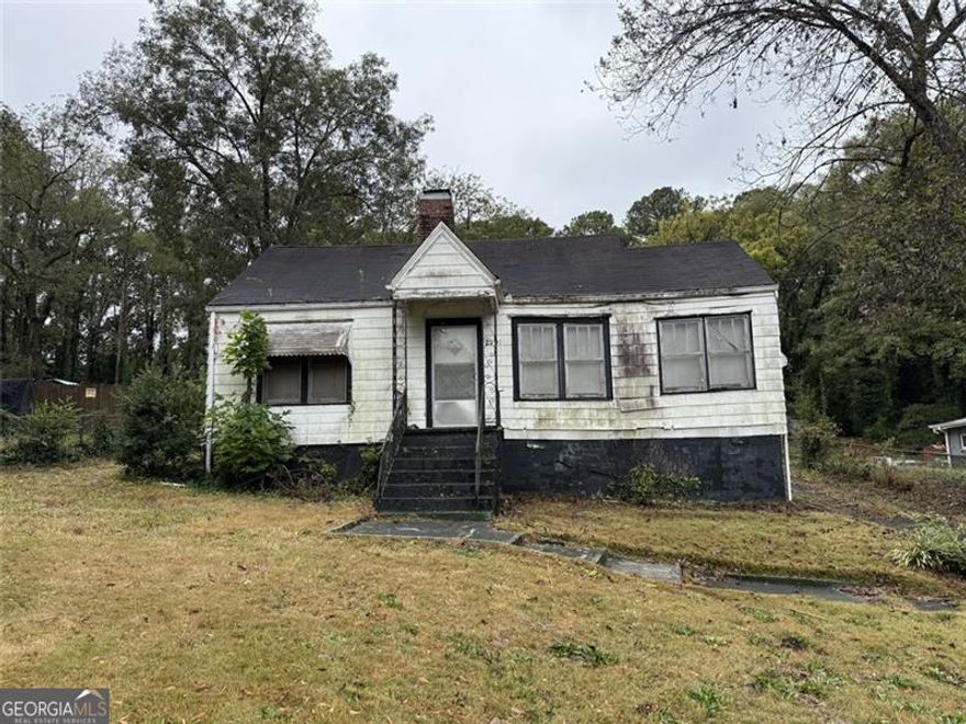INVESTOR/HANDYMAN SPECIAL  This 3-bedroom, 1-bath home with just under 1400 sqft sits on a spacious lot almost 3/4 acre.  Endless possibilities exist for those ready to roll up their sleeves and build equity.    The home needs TLC, but the bones are there - solid structure and room to reimagine. Update the existing space or add square footage to increase value and appeal.  There's even potential for a workshop, garden, ADU or all three.  Minutes to major highways, Hartsfield-Jackson Atlanta International Airport, and local shops and dining - convenient yet tucked away enough to enjoy some breathing room.