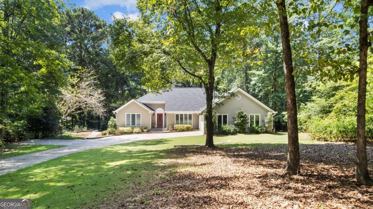 Beautiful ranch home with finished walkout basement in the heart of Peachtree City. This well maintained 4 bedroom, 3.5 bath home is move in ready and packed with updates, including a brand new roof! The spacious ranch layout has an oversized dining room, eat in kitchen and a huge great room with vaulted ceilings - perfect for entertaining or family gatherings. The finished basement provides extra living space - ideal for guests, teens and a home office or recreation. Set on a beautifully landscaped 1.1 acre lot, this property combines privacy with curb appeal. Set your appointment to view this one!