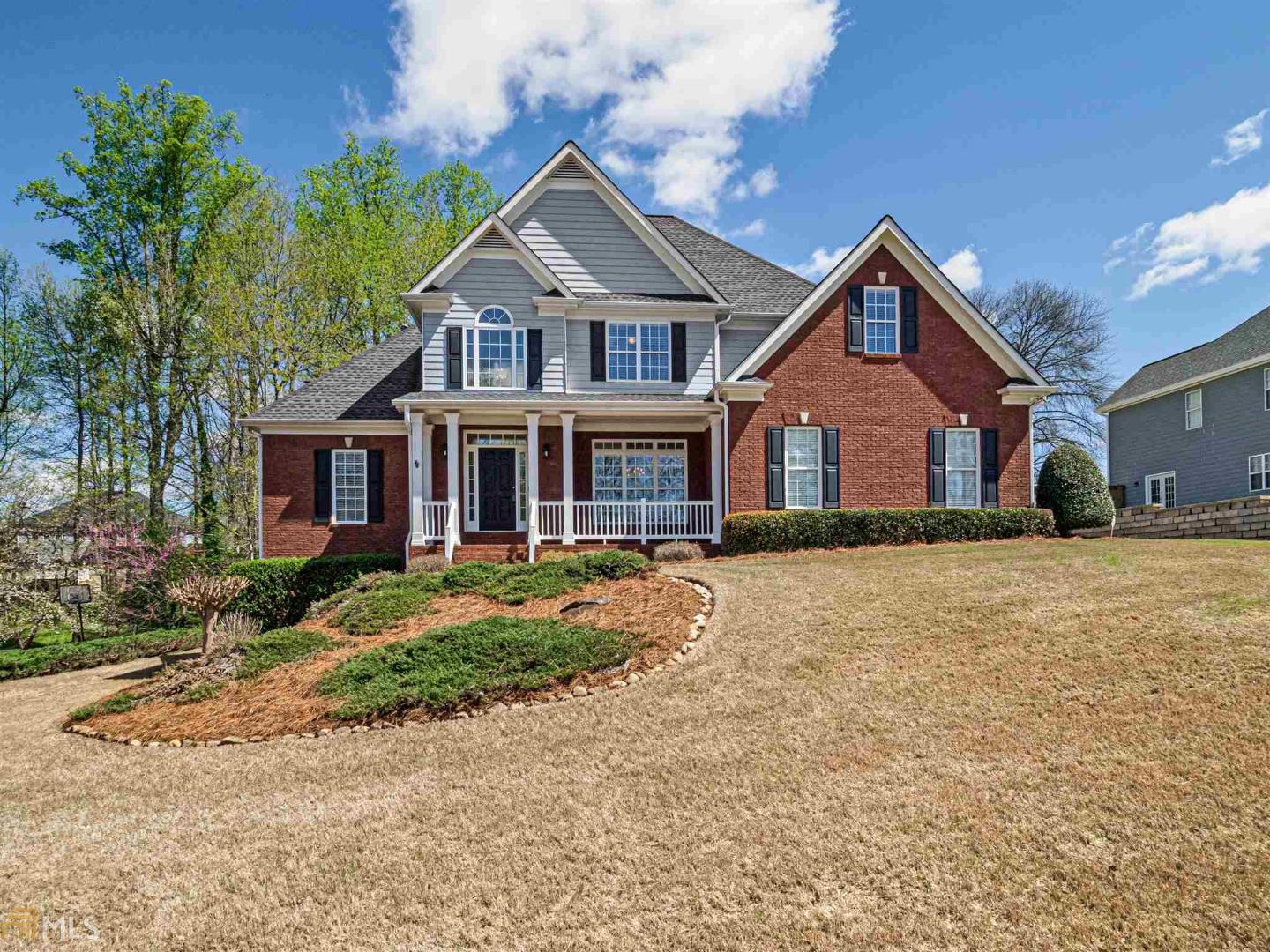 Beautiful 2 - Story w/ Soaring Ceilings! 2 Story Foyer & Family Room w/ Open Stair case. Formal Dining Room, Spacious Kitchen w/ B'fast Bar, Pantry, Vaulted Sunny B'fast Area, Guest Bedroom & bath, Laundry Mud Room w/ Wash Tub, Master Suite w/ Trey ceiling & Deluxe Vaulted Spa Bath w/ Huge Walk in Closet!Upstairs 3 Bedrooms, Jack & Jill Bath, Basement Level w/ Rec Room, Office, Work Out Rm, Large Storage / workshop area, bath stubbed. Oversized 2 Car Side Entry Gar w/ opener. Alarm System. Amazing Yard - Professionally Landscaped. Close to I-85 & Chateau Elan!
