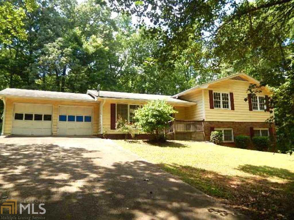 Large brick & frame split foyer with finished lower level* Great location near I-20 & Thornton Road* Nice formal living room greet your guest* Spacious sunny eat in kitchen with white cabinets* Awesome sunroom overlooks private wooded yard* Nice den on lower level with brick fireplace* Well established neighborhood in Austell* Don't delay call us today*
