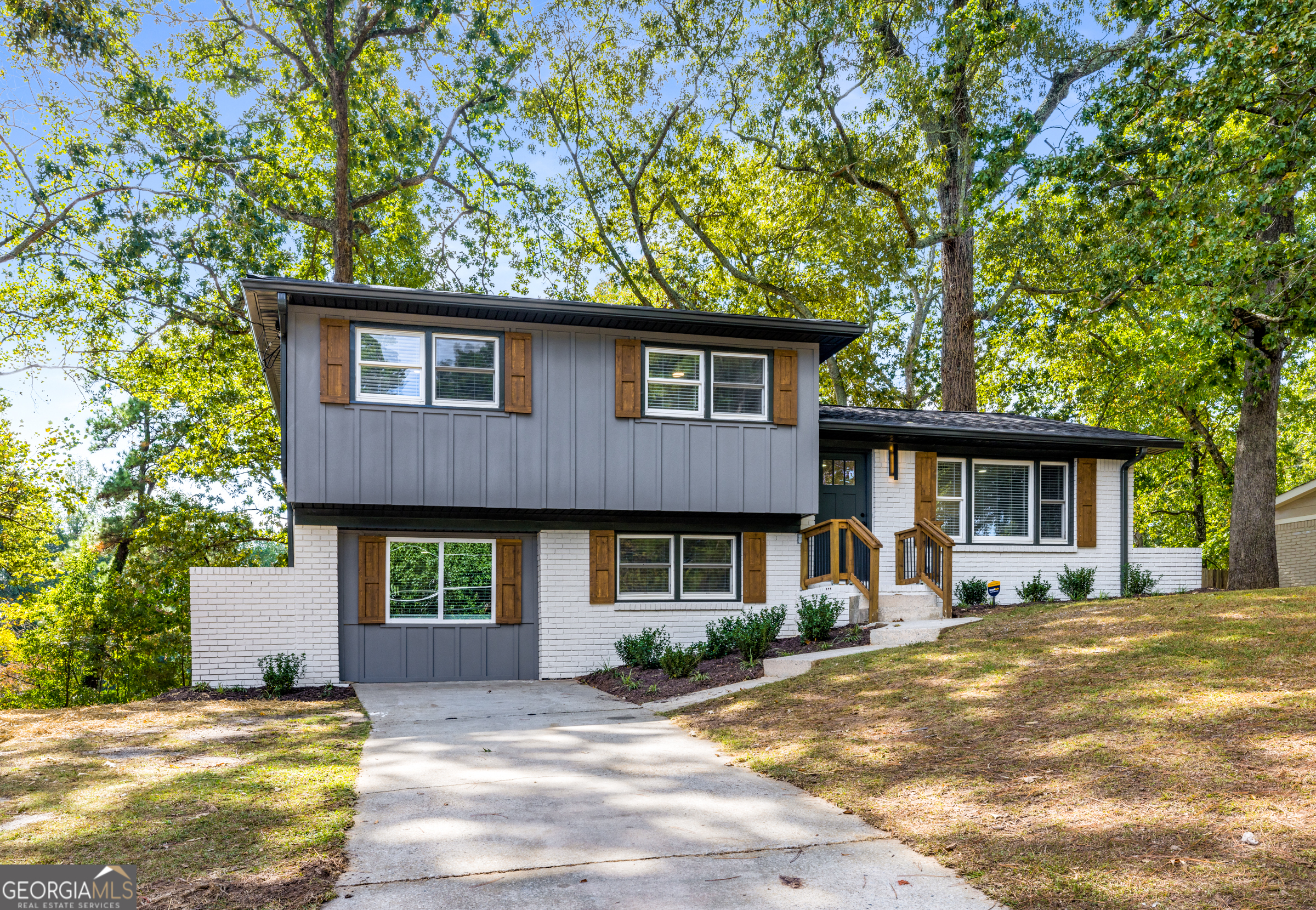 Step into this beautifully transformed 3-bedroom, 2.5-bath home where style meets functionality. Located in desirable East Atlanta, this home has been thoughtfully renovated with high-end finishes and interior selections curated by Maureen S Designs, creating a cohesive and elevated living experience. Inside, you'll find New SS Appliances perfectly complementing the 42-Inch Cabinetry, along with New Flooring, Modern Lighting, and Smooth Ceilings throughout. Every detail, from the hardware to the color palette, reflects intentional design and modern sophistication. The Open-Concept Living Space features a striking Deco accent wall with an electric fireplace, Bringing Warmth and Personality to the Home. Downstairs, the Open Basement/Den offers Endless possibilities-use it as a media room, home office, or easily configure it into an Optional 4th bedroom. The Spacious Laundry Rm adds extra Functionality for storage Step outside onto the New Wooden Deck that overlooks a Large, Private Backyard--perfect for Entertaining or Unwinding. With Updated Electrical, New HVAC & Plumbing Systems, and a Pre-inspection already Completed, this home is 100% ready for move-in. Don't miss this designer-renovated gem in one of Atlanta's most vibrant neighborhoods-schedule your private showing today! THIS HOME QUALIFIES FOR A $10,000 NO-STRINGS-ATTACHED GRANT-NO INCOME LIMITS. INQUIRE FOR DETAILS!