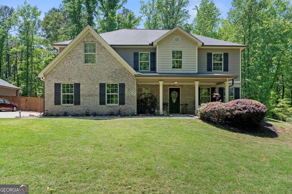 Come see this beautifully maintained 4-bedroom, 2.5-bath home sits on a spacious and level 0.8-acre lot, just minutes from the vibrant and growing downtown Auburn. Built in 2019, the home features fresh interior paint throughout and brand-new flooring on the main level, completely move-in ready. The heart of the home is the open-concept kitchen, complete with granite countertops, a large island, stained cabinetry, stainless steel appliances, and a generous walk-in pantry. It flows seamlessly into the living room, where a cozy fireplace makes for the perfect gathering spot. Upstairs, you'll find four generously sized bedrooms, including a luxurious primary suite with tray ceilings, a sitting area, and a spa-like bathroom featuring a soaking tub, separate shower, and dual vanity. Laundry is conveniently located upstairs as well, along with three additional bedrooms, each offering ample closet space. Close to everything you could need-shopping, dining and easy access to highways like GA316, 29, . 20 minutes to Athens, 10 minutes to Dacula, and 15 minutes to Winder. Come see what Auburn has to offer with it's weekly farmers market, car shows food trucks and festivals. New development coming soon with an amphitheater, new restaurants, shops and a brewery.