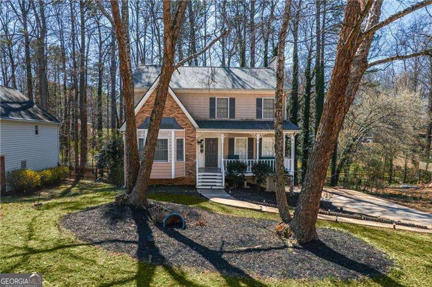 **Charming 4-Bedroom Home Near Kennesaw Mountain**      Welcome to this beautifully updated **4-bedroom, 2.5-bathroom home** located in the sought-after **Zachary Woods** community, just minutes from **Kennesaw Mountain** and within the highly rated **Kennesaw Mountain High School district**.      Step inside to find **brand-new sustainable flooring** throughout the main level, along with elegant **high-end tiling in the kitchen**. The kitchen has been completely remodeled, featuring **new appliances, granite countertops, stylish backsplash, and brand-new cabinetry** with upgraded drawer systems for maximum functionality. The home also includes a **separate dining room**Coperfect for hosting gatherings.      Upstairs, the **oversized master suite** boasts raised ceilings, a **walk-in closet with built-in shelving**, and a **master bath with a shower/tub combo**. Two additional bedrooms and another full bathroom complete the upper level.      The **partially finished basement** includes **new sustainable flooring, ceiling tile, and a track system**, offering extra living or storage space.      Outside, enjoy the **screened-in porch and fenced backyard**, with the potential to extend the fence to the property line, which reaches the **nearby creek**.      Additional features include a **two-car garage with a new motor, remotes, and a built-in shelving/workstation**. Plus, residents of **Zachary Woods** can take advantage of the **optional low-cost swim/tennis membership**.      Don't miss your chance to own this beautifully updated home in an unbeatable location! Schedule your showing today.