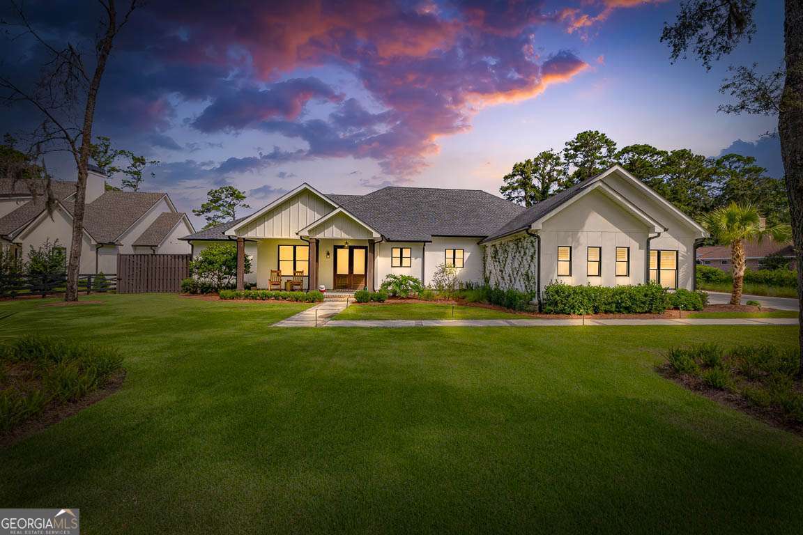 Finished in 2023, this stunning 4-bedroom, 3.5-bath home offers like-new luxury with thoughtful design and high-end finishes throughout. Step through the foyer into a spacious layout featuring a dedicated office, a vaulted and beamed living room with custom built-ins and an electric fireplace, and a flexible family room space. The open-concept kitchen is a chef's dream, boasting a massive island with breakfast bar, Bosch stainless steel appliances, a butler's pantry, and a separate dining area. Luxury vinyl plank flooring runs throughout the home, complemented by a built-in office closet and a modern security system. The primary suite showcases elegant double tray ceilings and a spa-inspired ensuite with a wet room, soaking tub, dual vanities, and a large walk-in closet. Additional features include a mudroom, a generous laundry room, and a 3-car garage complete with sink and storage closet. Step outside to a true backyard oasis: a covered back porch equipped with an outdoor kitchen, electric fireplace, and retractable electric screens-perfect for year-round entertaining. The fully fenced yard offers maximum privacy with an 8-foot fence and includes an inground, state of the art, heated pool with spa and a cozy firepit area for relaxing evenings. This home combines luxury, function, and comfort in one exceptional package. No detail was left out on this one! Must see to appreciate!