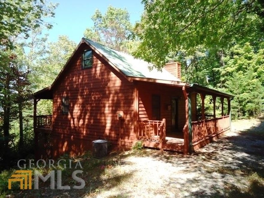 "What everyone wants" 2BR, 2BA cabin in the woods with over 1,000 acres of national forest right out the front door! Take in the year-round MEGA views from the back porch. Cabin features wide plank ponderosa pine walls, tongue and groove pine ceilings, beautiful wood floors and a vaulted ceiling in the den with exposed cedar beams. Cozy up to the wood burning rock fireplace during the cooler months. Master on the main with a full bath, plus a sleeping loft above as well. Downstairs you will find a full basement with a second den or entertainment area (great space for kids). A full bath is in the basement plus a large mechanical/storage room used for hobbies or extra storage. Outside you will find the peacefulness of the end of the road privacy and the canopy of trees provided by the national forest!
