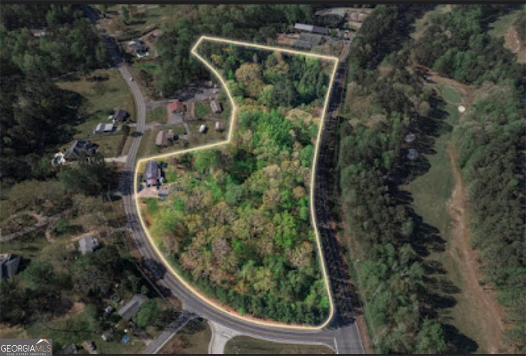 Over 10 Acres of prime commercial land. 5 Acres zoned GC and another 5 zoned NC. There is a 3 Bed 2 Bath home on the property that would need a lot of work and most likely would need to be removed