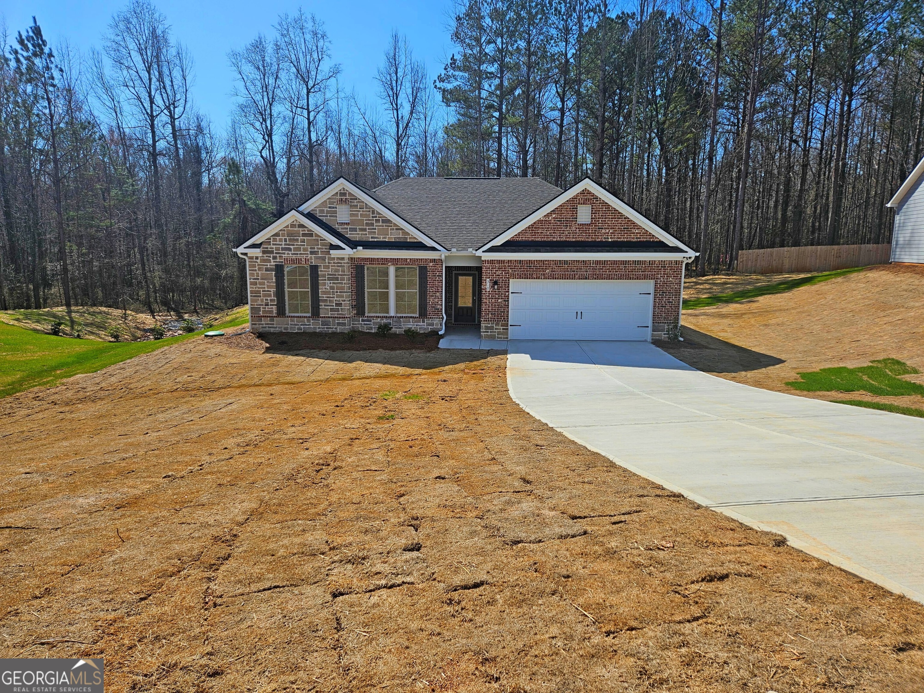 The Madison Plan built by My Home Communities. The community is located 10 minutes from Atlanta Motor speedway. This 1 story floor plan will feature a large kitchen/ breakfast area open to the over size family room, and a Large Primary and secondary baths, Full brick/Stone Front and Covered Back Porch with a Fan. Quick Move-In. Secondary photos are stock photos.