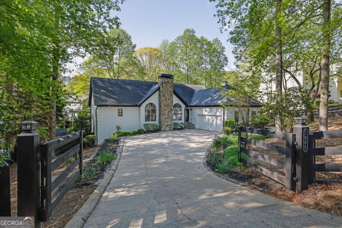 Prime Location Walk to Downtown Milton! Welcome to this beautiful, immaculate ranch home with a finished terrace level, ideally located in the heart of Alpharetta/Milton. Just minutes from Downtown Alpharetta and a short stroll or bike ride to beloved local spots like MiltonCOs, Olde Blind Dog Irish Pub, Six Bridges Brewery, and more. Recently refreshed inside and out, this home features fully remodeled kitchen and bathrooms with high-end, designer finishes, luxury vinyl plank flooring, fresh paint throughout, Cono detail has been overlooked! The main level offers a spacious Primary Suite with a walk-in closet and spa-inspired ensuite bath. Soaring cathedral ceilings in the family room create a bright and open gathering space, while two additional bedrooms are located on the opposite wing for added privacy. The showstopper deck crafted from exotic Brazilian Cumaru and Ipe hardwood offers an impressive space to relax or entertain, overlooking the private backyard. Downstairs, the fully finished terrace level includes a second kitchen, pantry, and dining area, along with a bedroom, full bath, and two expansive bonus rooms perfect for a media room, gym, home office, or guest suite. Enjoy evenings by the firepit, mornings on the deck, and the lifestyle that comes with NO HOA and a location that truly can not be beat. If you find you love the home as you see it, the sellers are willing to offer the furnishings, please inquire for pricing. This home blends elegance, space, and convenience Come experience it for yourself!