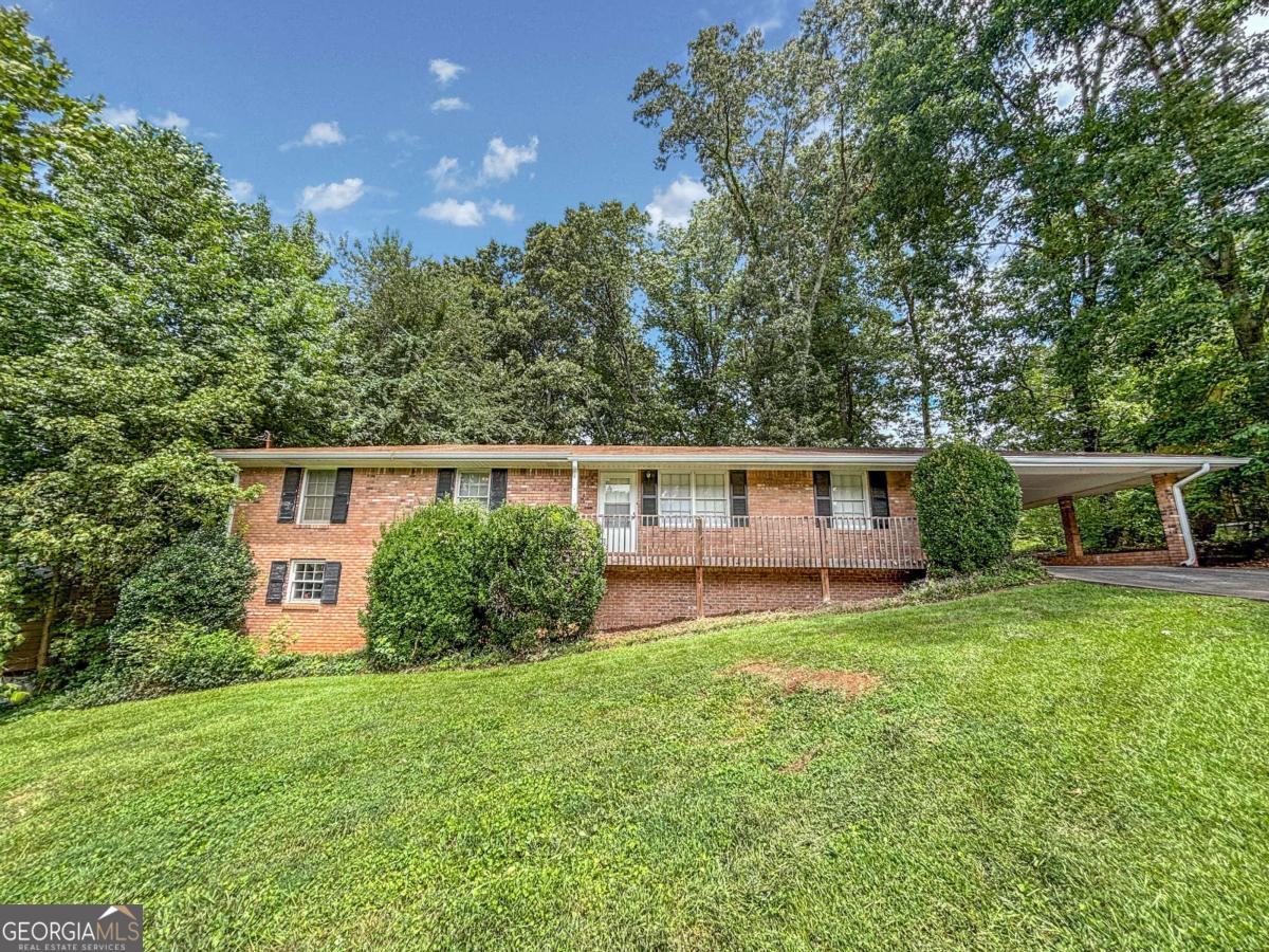 Available Now! Spacious brick ranch has just been renovated. New Appliances, Fresh Paint, New Plank Flooring in Liv Rm / Kitchen, New Light Fixtures and More. Spacious open plan with Kitchen open to living and dining spaces. Large Master Bedroom with New Carpet and New Bathroom Vanity. Two Guest Bedrooms with Hardwood Floors. Full unfinished basement for storage or crafts. Laundry and Storage room off 2-Car Carport. Great oversized deck overlooks private backyard. Resident Benefit Package included. Rent quoted reflects discount for on time payment, ask for details. Check out our 5-Star reviews on Google