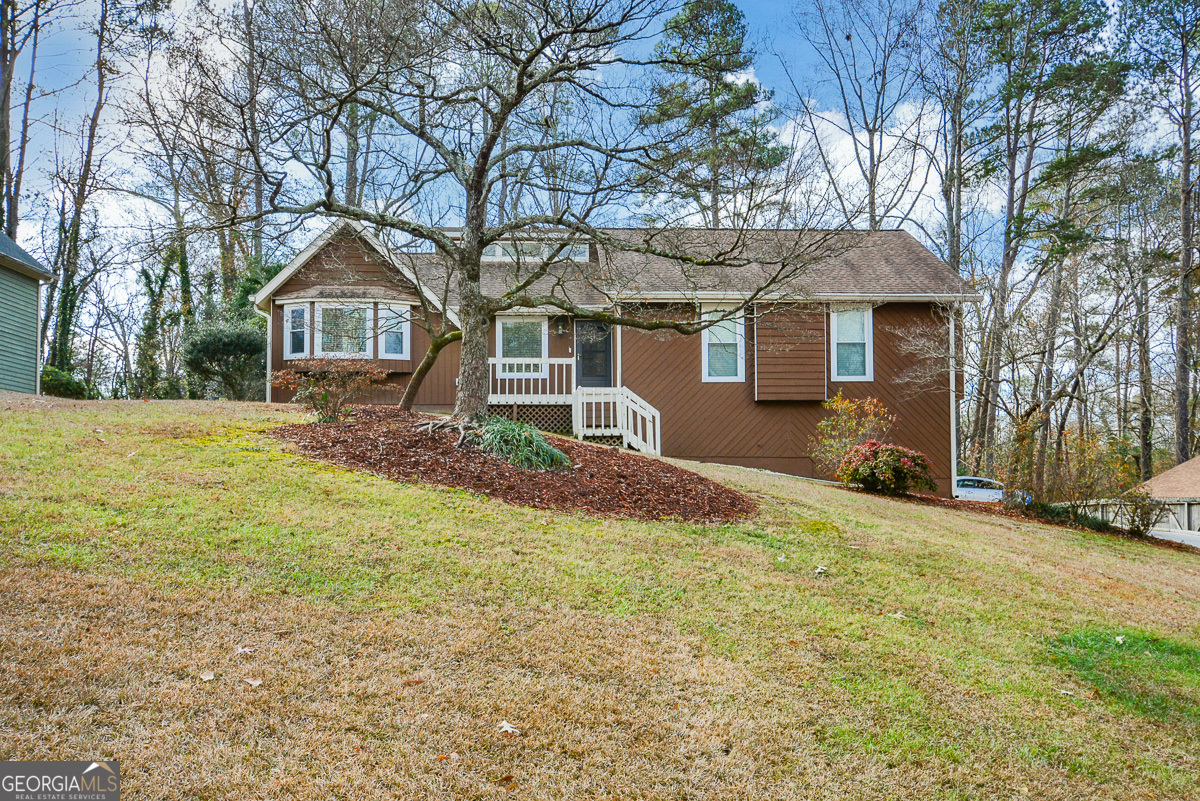 SOLID AS A ROCK! This impeccable home has been well maintained and loved. Walk in and you will feel a calm come over your shoulders! Neutral colors throughout, nice natural light throughout, gleaming hardwood floors, large living spaces and lots of updates! The kitchen boasts a beautiful glass tile backsplash, soft close wood cabinets, granite countertops, upgraded fixtures, new black stainless steal appliances - ALL STAY and are Wifi capable, 5 burner gas stove, breakfast bar, recessed lights and eat in kitchen with a bay window! Windows have been replaced, blinds will stay, LED lights throughout the home, 3 way outlets, new upgraded HVAC and upgraded electrical! Brand new Rheem 100,000 BTU 2 staged furnace with a 10yr transferrable warranty! This home offers a separate formal dining room and the family room off of the dining is quite large and showcases a granite surround gas fireplace! The secondary bedrooms are spacious and you will find every bedroom in the house offers walk in closets! The master suite is oversized and the master bath has a double vanity, tiled floors and a tub/shower combo. You will find storage in the attic which is accessible from the closet. The hall bathroom has a thermostat you can turn on to heat the bathroom while you are showering, tiled floors and a new vanity with a tile surround tub/shower! Walking downstairs you will find iron spindles and the light automatically comes on as you enter! Basement can be a in law suite, teen suite, or you can rent it out for passive income! There is a huge walk in closet, more gleaming hardwood floors, a bedroom with double doors, closet, sitting room and full bathroom with a new vanity, tile surround shower with built in bench, and temperature gauge to heat so when you come out of your shower you stay toasty! There is a very large living area with a closet! Basement ceilings are drywall with recessed lights and a trey ceiling! Storm door will lead you into a oversized 2 car garage with storage areas! Drive up to your newly paved concrete driveway with an extended pad for at least 2 more cars! The lot is large and private! Custom built shed with an upper loft area and tons of storage space! Fenced private backyard. What more can you want?!?!