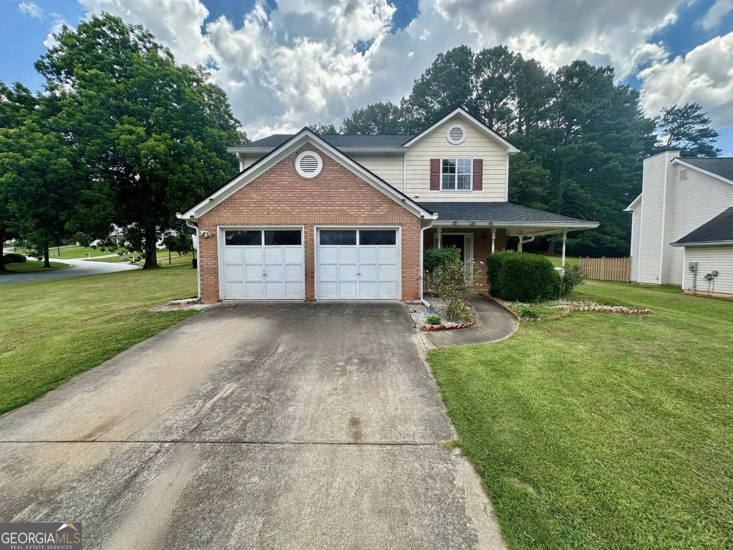 This charming and well-maintained two-story home is located on a quiet street in the heart of Lilburn, situated on an oversized corner lot with a spacious front and backyard. Featuring three bedrooms, two and a half bathrooms, and an attached two-car garage with additional driveway parking, the home offers both comfort and functionality. The main level welcomes you with brand-new luxury vinyl plank (LVP) flooring and a spacious family room with a cozy brick fireplace. A formal dining room flows into a large kitchen, which includes granite countertops, stainless steel appliances, ample cabinet space, and a clear view into the family room-making it a perfect layout for entertaining or everyday living. A convenient half bathroom is also located on the main level, and French doors open to the backyard, enhancing the home's indoor-outdoor living appeal. Upstairs, the oversized primary bedroom features a beautiful tray ceiling, a generous walk-in closet, and an en-suite bathroom with double vanities, a soaking tub, and a separate standing shower. Two additional bedrooms each offer walk-in closets and share a full second bathroom. The laundry room is also located upstairs for added convenience, and the lease includes a washer and dryer. Additional highlights of the home include central air conditioning, a covered front porch, modern light fixtures, and updated flooring throughout. The large, level yard provides plenty of space for play, gardening, or outdoor gatherings. Located in a quiet and well-kept neighborhood, the home offers easy access to local parks, grocery stores, shopping centers, and major roadways. If you're looking for a move-in ready rental home with space, charm, and modern updates, this Lilburn gem is not to be missed! The home will be available for lease beginning July 16th. For more information or to schedule a tour, contact Olivia Robinson.