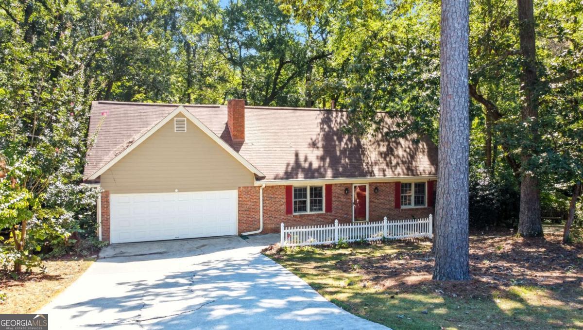 Charming Cape Cod-inspired home on a rare .74-acre cul-de-sac lot! Tremendous upside and flexible living options with a fully finished, self-contained basement apartment. Walking distance to Honey Creek Golf Course (fairway visible from the front yard) and backing to a peaceful creek, this 1984 home offers approx. 2,500 sq ft across three levels: master on the main with ensuite, two bedrooms and full bath in the upper level and a basement that contains 2 bedrooms plus a kitchenette, full bath, laundry/washroom and living areas - perfect as an in-law suite or immediate rental/income unit. This home is a true blank canvas for buyers who want to add immediate value. Don't miss this rare combination of location, lot and income potential in 30094 - schedule your showing today and ask about the lease-to-own option.