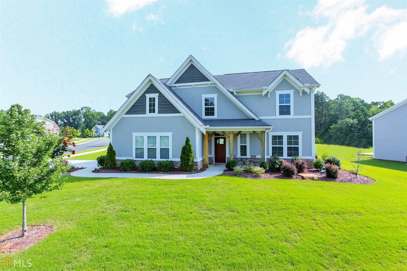 Exceptionally beautiful 3 bedroom, 3 full bath one half bath house located in an amazing sought after Braselton community. The amazing open floor plan offers hardwood floors, master on main, gorgeous modern kitchen with granite counter-tops, stainless steel appliances and a large island. Upstairs has 2 spacious secondary bedrooms with a huge loft/study. This beautiful home is within walking distance to the spectacular community pool and clubhouse. Definitely a must see!