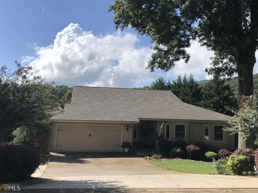 Enjoy Country Club living in The Orchard, Northeast Georgia's premier Golf and Country Club community. Mountain and golf course views in this 5 BR/3 BA Ranch with open floor plan and spacious kitchen. Master and two BR on the main floor. Finished terrace level has a large family room with Fire Place,  two large BR and very large bath. This house has lots of storage space, large balcony deck with retractable awning and also large screened porch. Meticulously maintained and ready to move into.