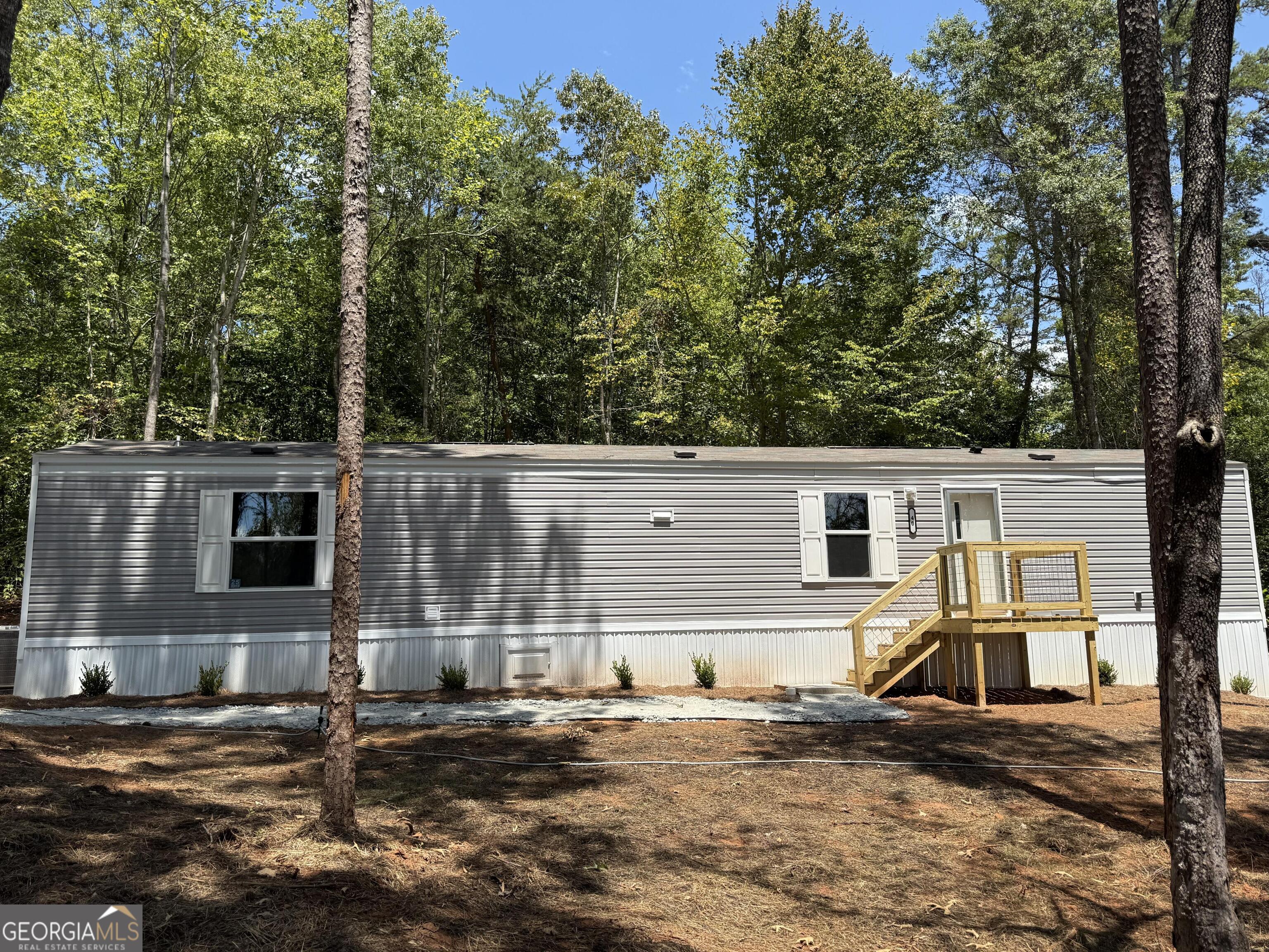 Brand New Construction...2024 Clayton Tru Delight..Spacious 2 Bedroom 2 Bathroom, open floor concept, includes all brand new kitchen appliances, home comes with 1 year warranty, sits on private wooded half acre, has access to community pavilion, boat ramp, and dock on Lake Hartwell...just .5 miles from driveway! Located conveniently to Toccoa and Lavonia GA. Surrounded by nature, the property provides ample space for outdoor activities and enjoyment. Embrace the tranquility of rural living while still being conveniently accessible to nearby amenities and attractions. Don't miss the chance to own a piece of this beautiful landscape.